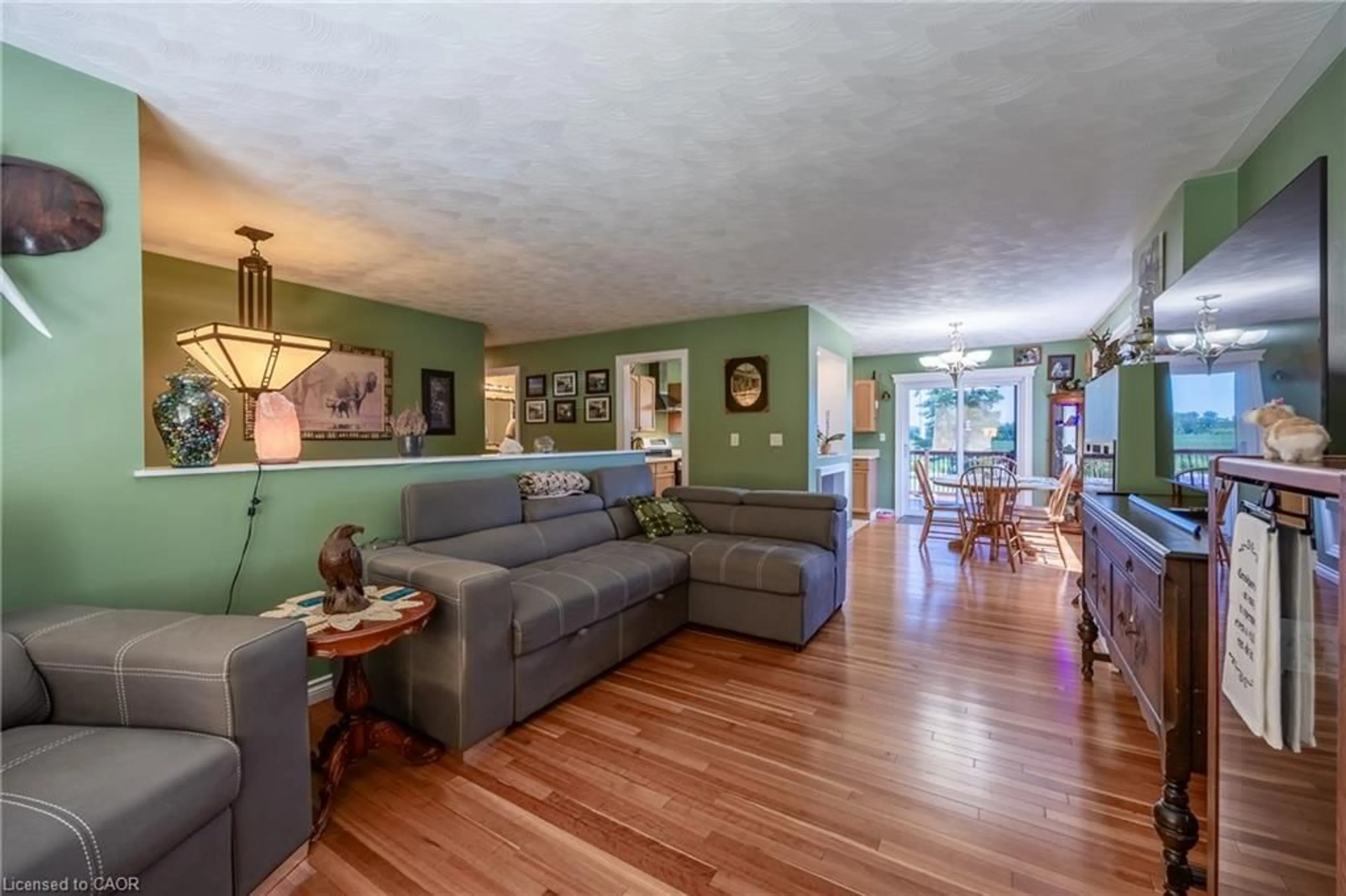 Living room with furniture, wood/laminate floor for 20 Port Ryerse Rd, Port Ryerse Ontario N3Y 4K2