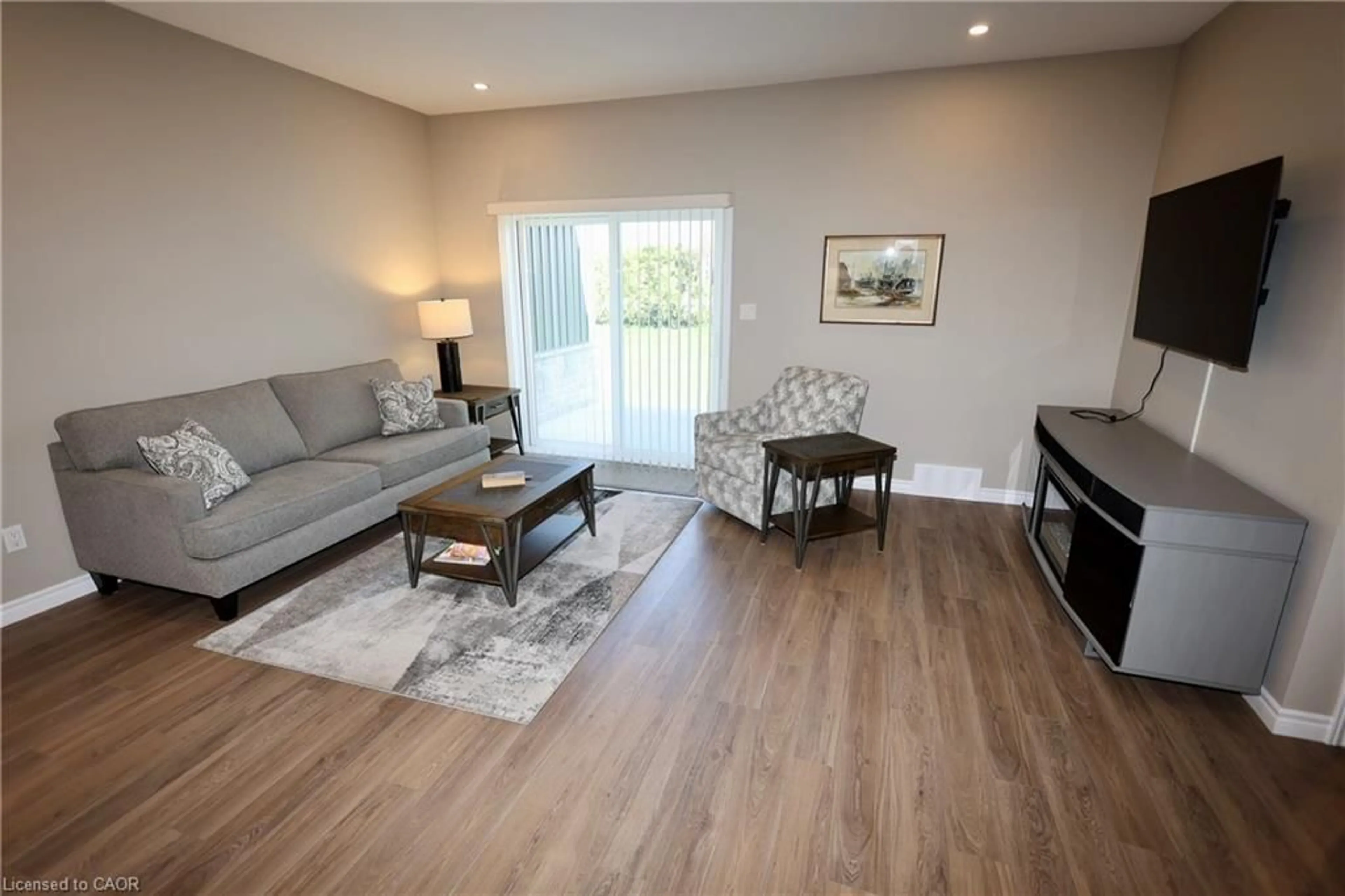 Living room with furniture, wood/laminate floor for 9 Silver Creek Rd, Seaforth Ontario N0K 1W0