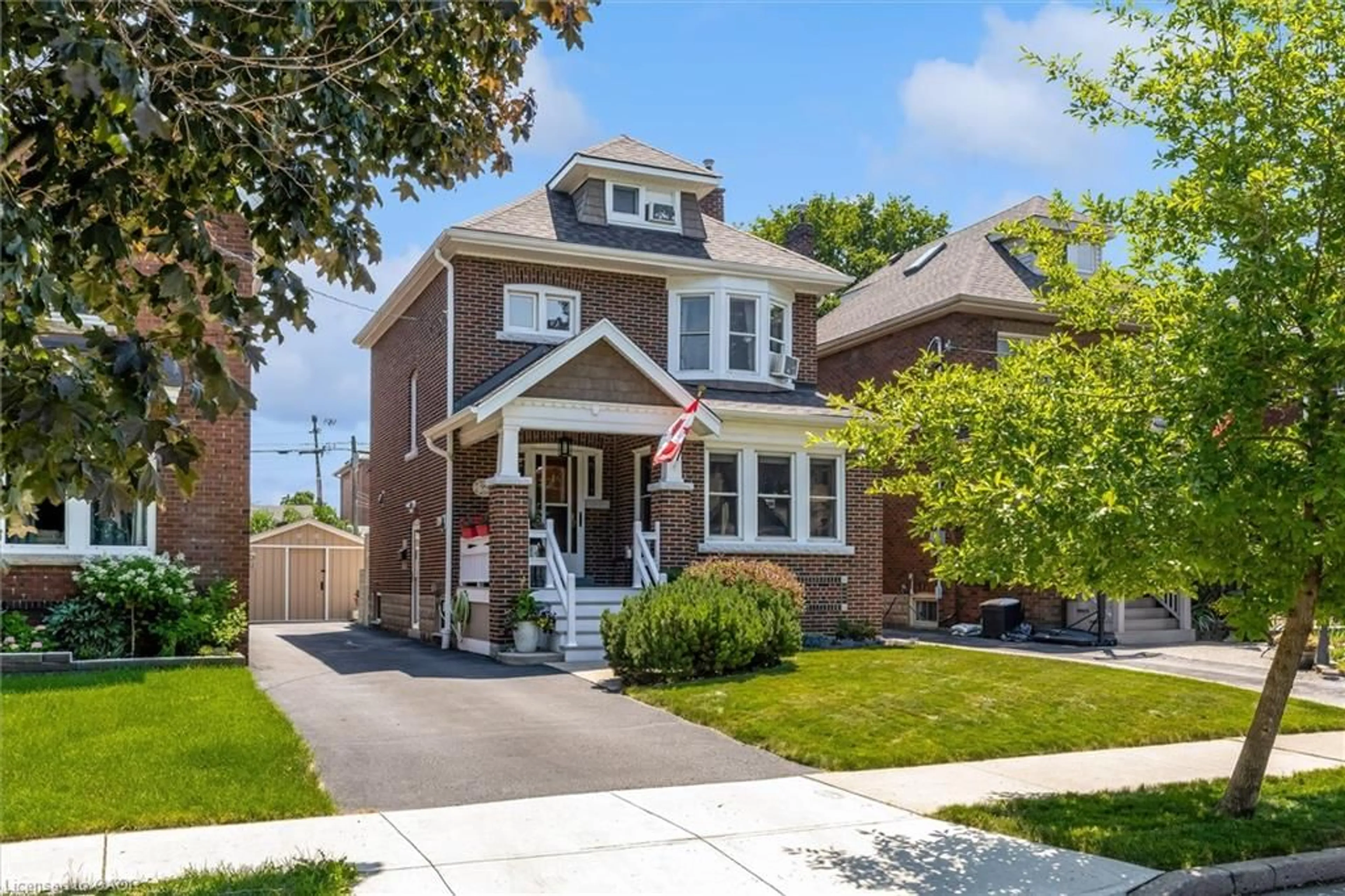 Home with brick exterior material, street for 99 Tuxedo Ave, Hamilton Ontario L8K 2R9