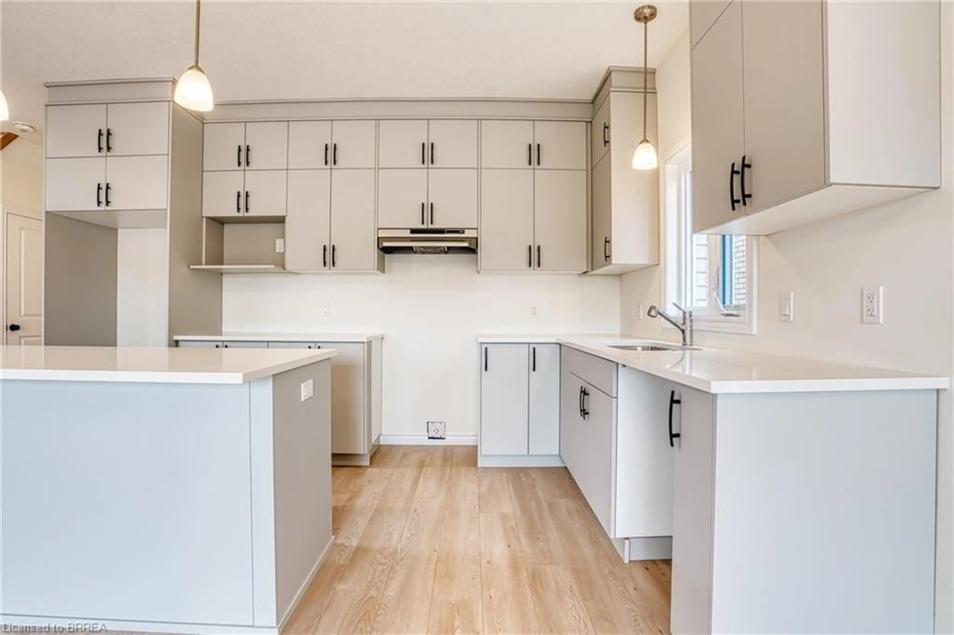 Open concept kitchen, wood/laminate floor for 30 Ford Dr, Stratford Ontario N5A 0L3