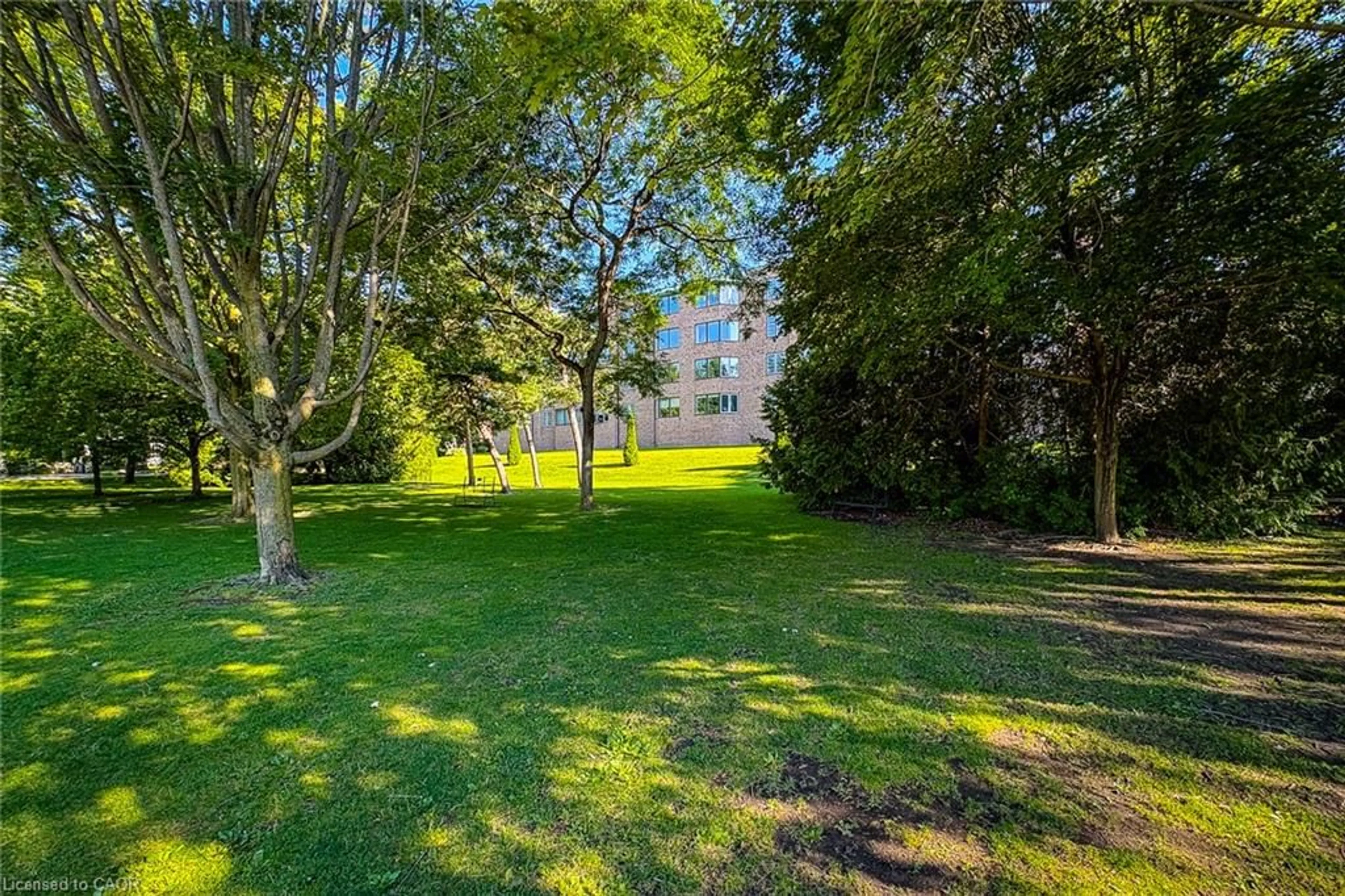A pic from outside/outdoor area/front of a property/back of a property/a pic from drone, forest/trees view for 30 Front St #107, Stratford Ontario N5A 7S4