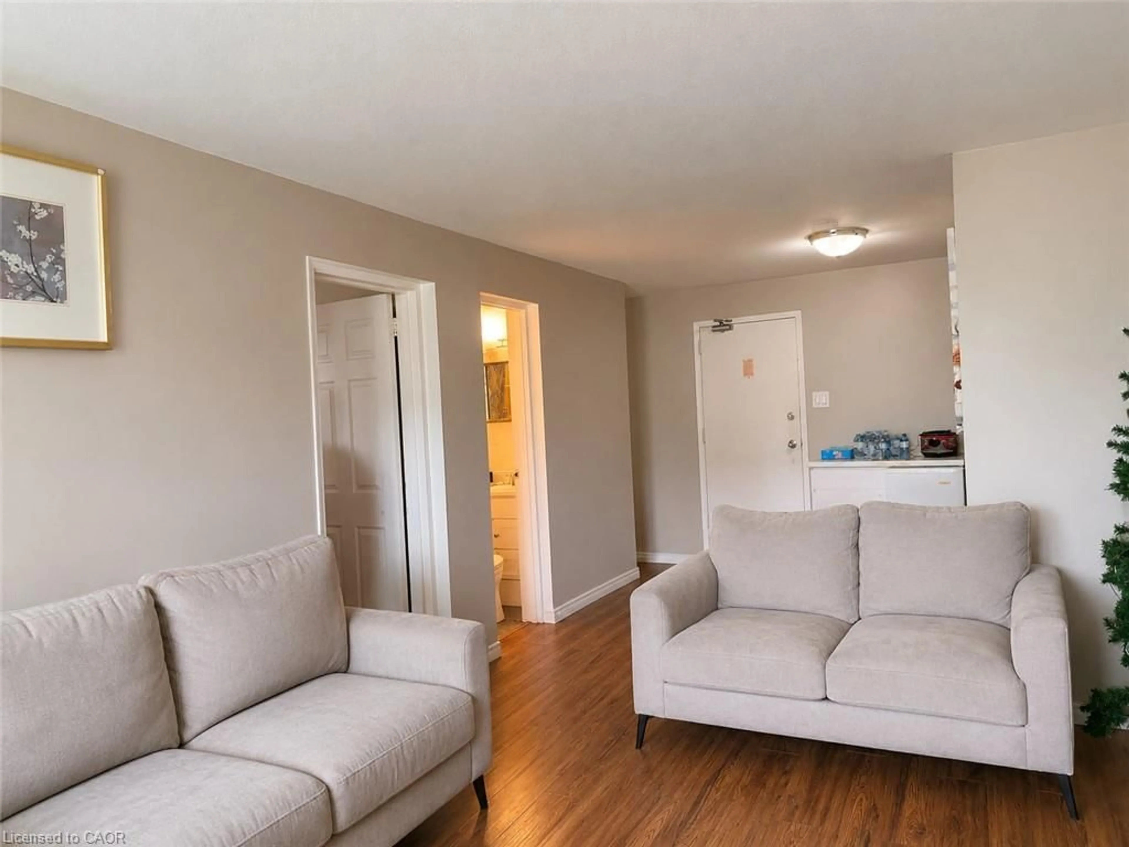 Living room with furniture, wood/laminate floor for 633 Barber Ave #7, Listowel Ontario N4W 1S4