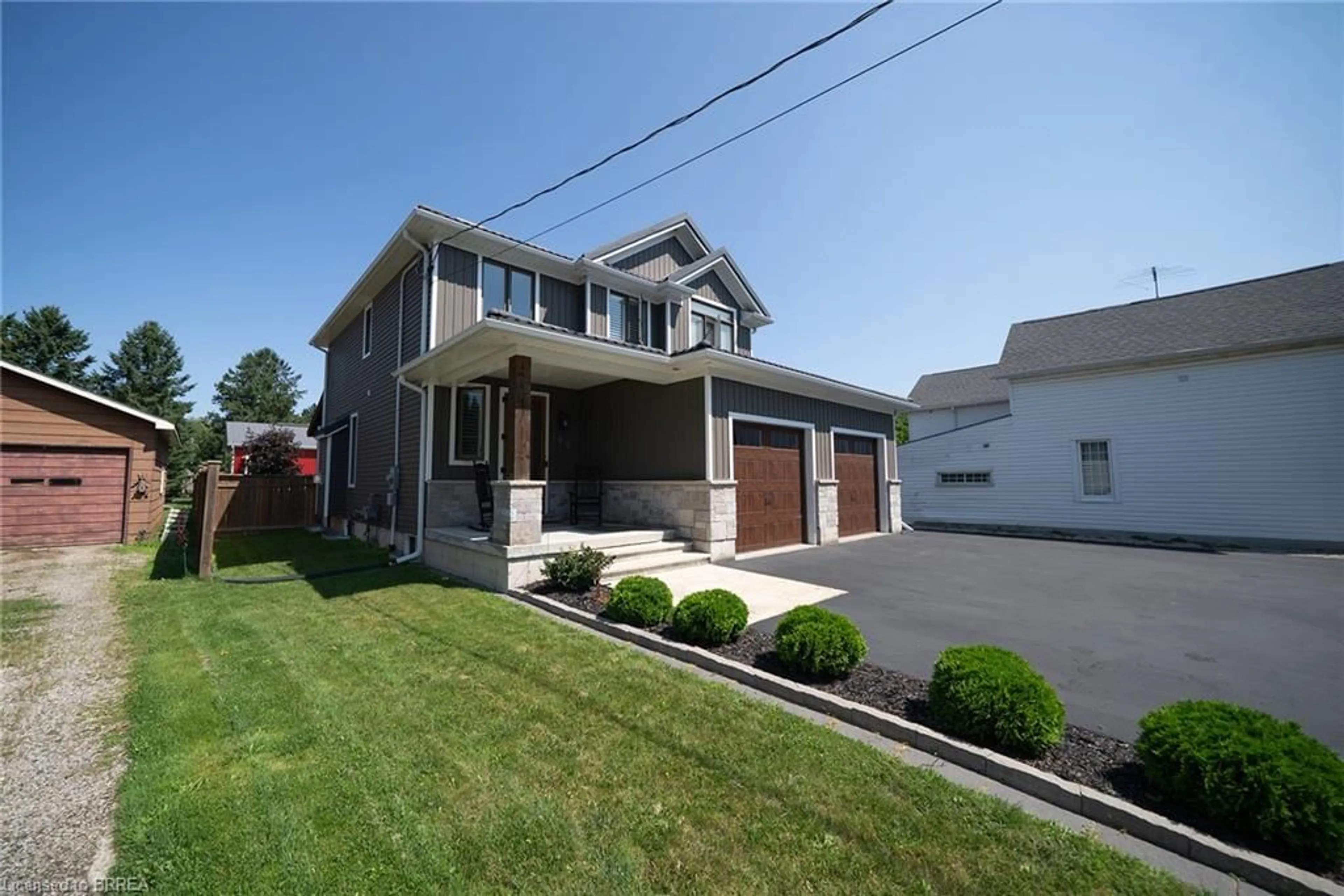 Home with vinyl exterior material, street for 166 King St, Burford Ontario N0E 1A0