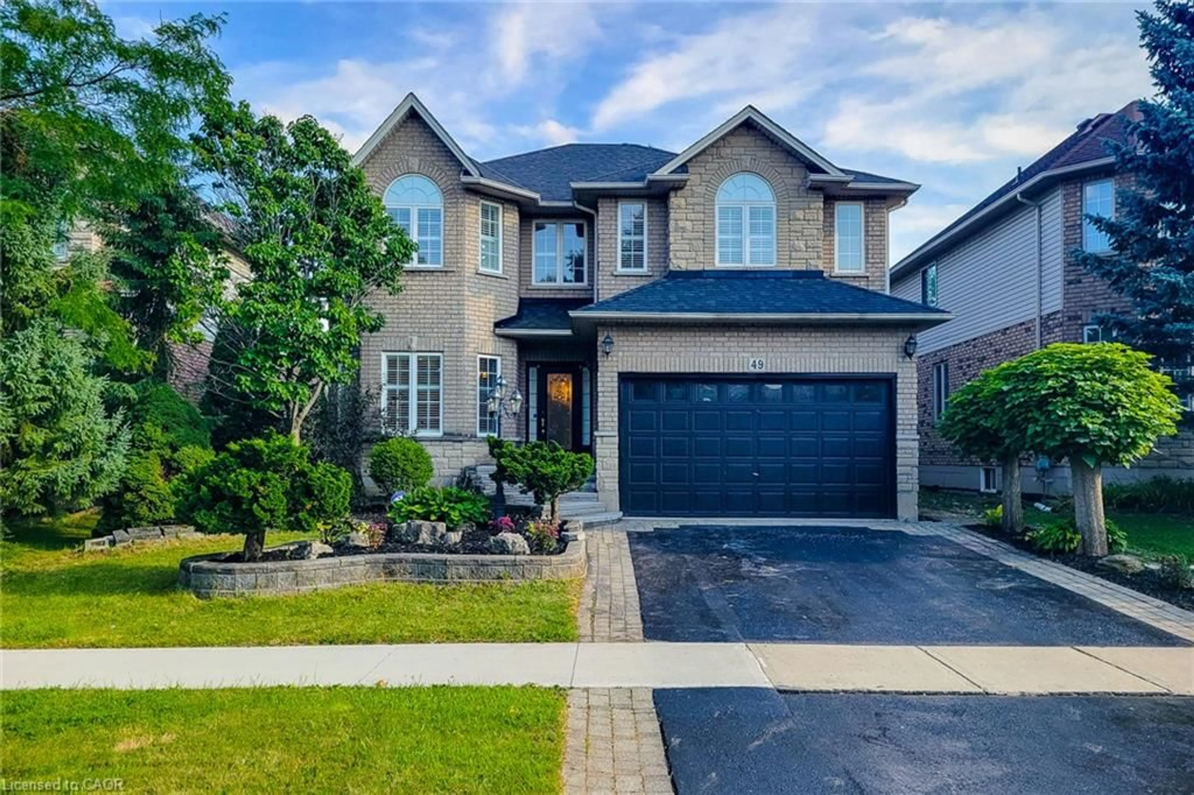Home with brick exterior material, street for 49 Stonehenge Dr, Ancaster Ontario L9K 1N6