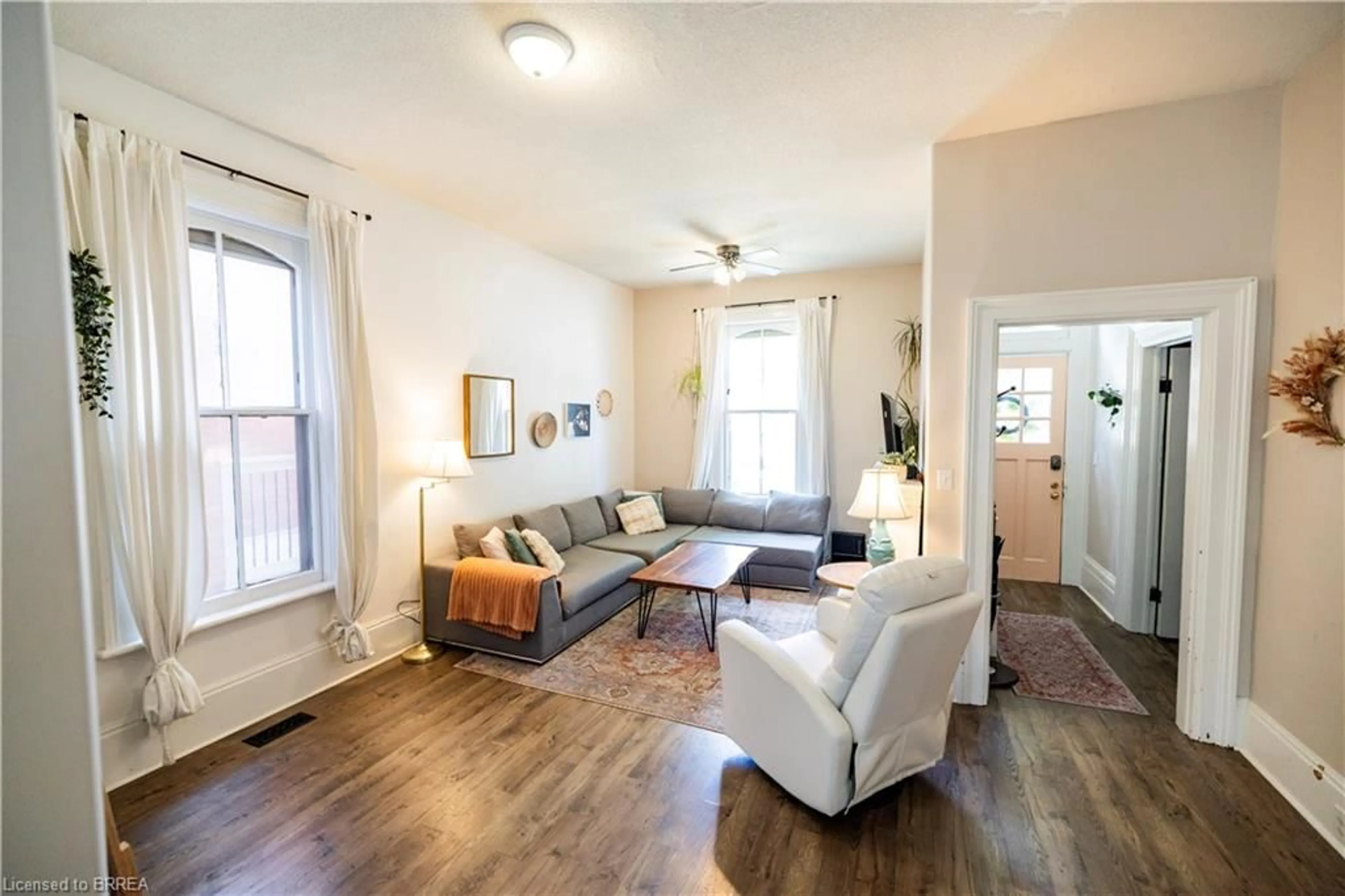 Living room with furniture, wood/laminate floor for 175 Albion St, Brantford Ontario N3T 3N1