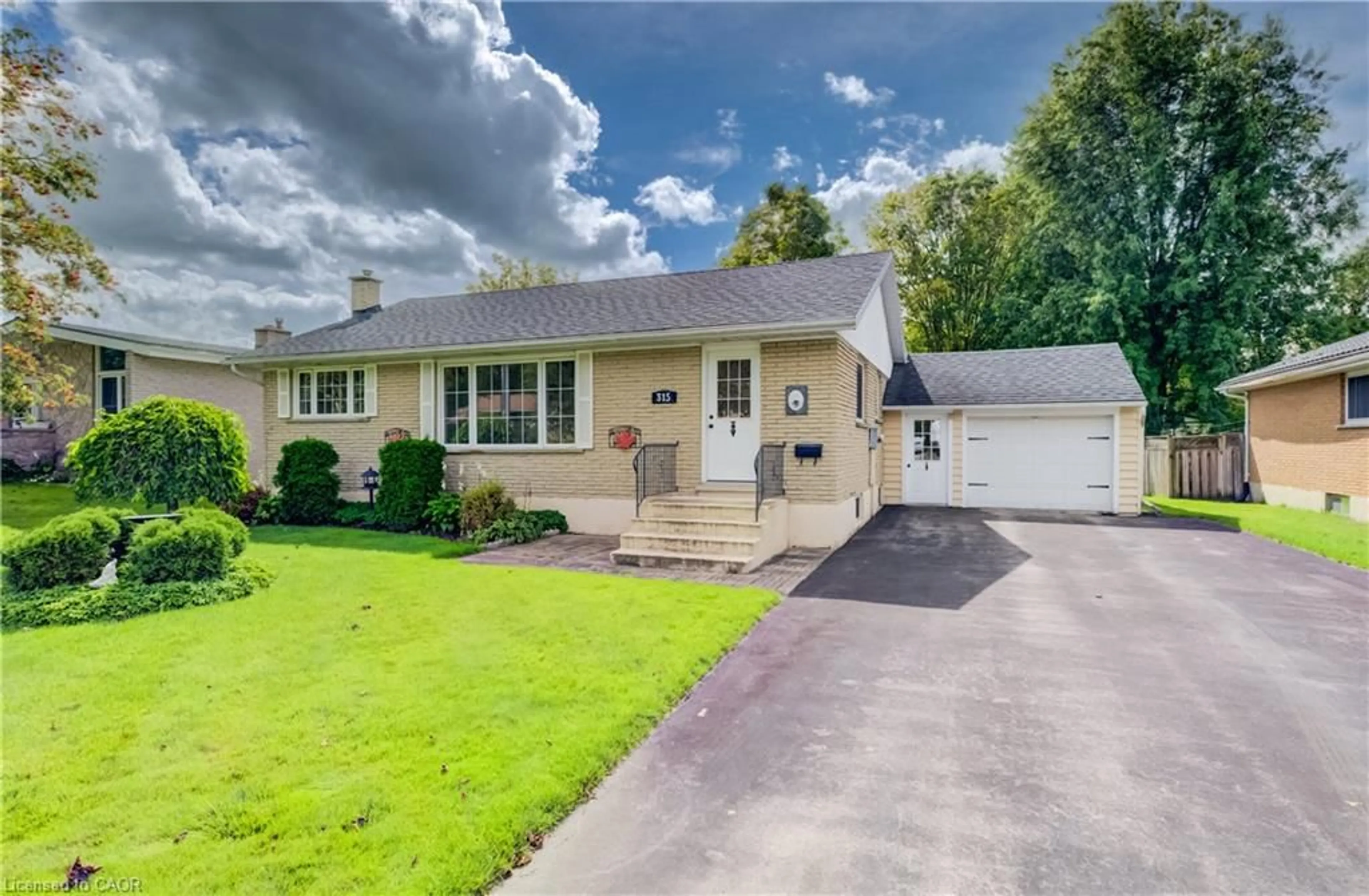 Home with vinyl exterior material, street for 315 Perth St, Mount Forest Ontario N0G 2L1