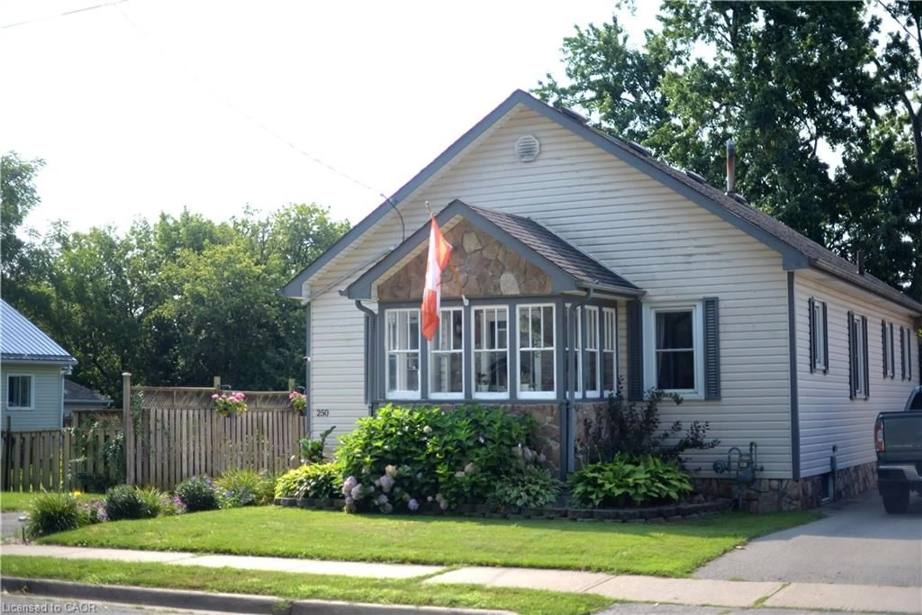 Home with vinyl exterior material, street for 250 Grove St, Simcoe Ontario N3Y 1K9
