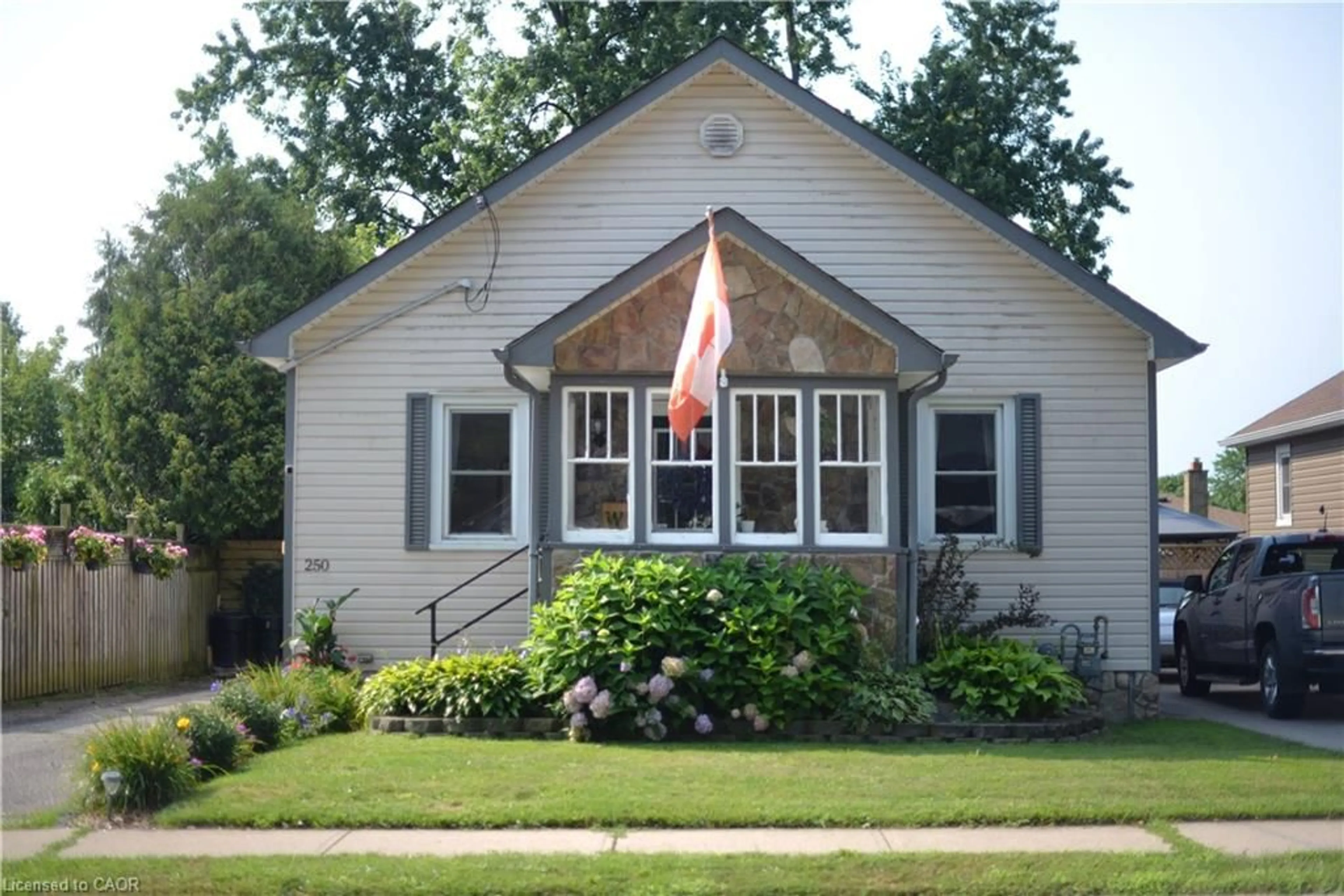 Home with vinyl exterior material, street for 250 Grove St, Simcoe Ontario N3Y 1K9