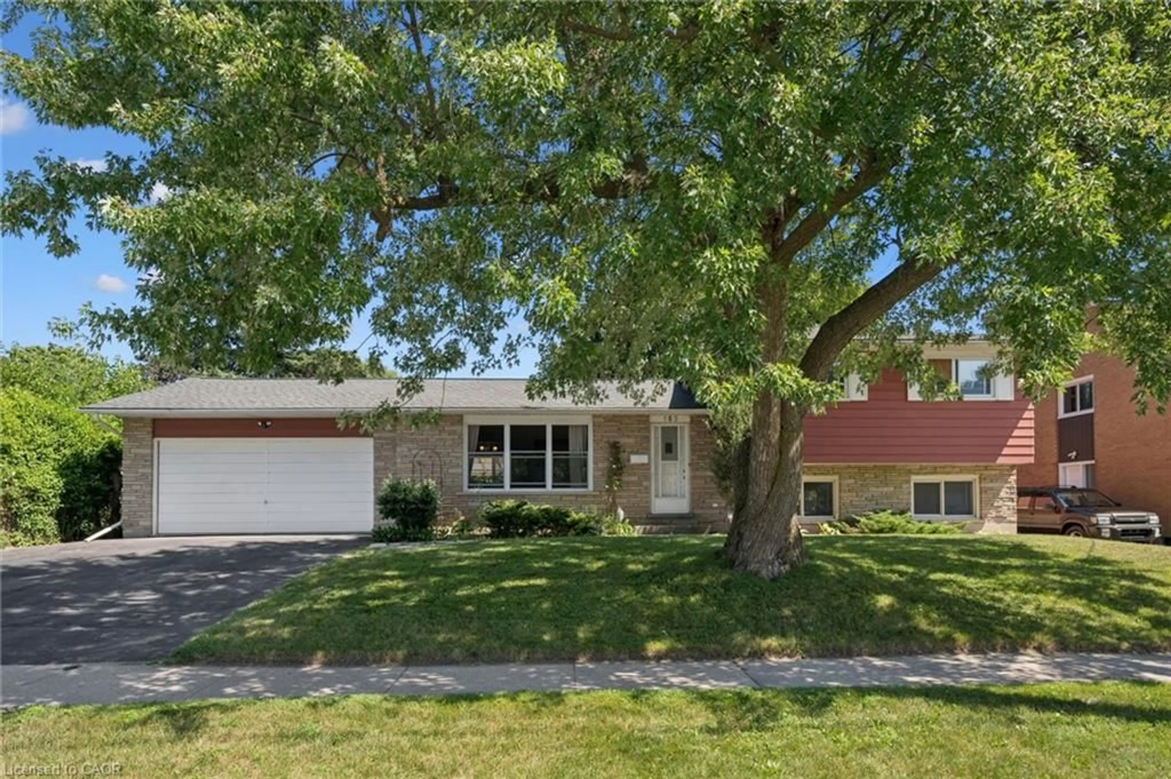 Home with vinyl exterior material, street for 153 Fourth Ave, Kitchener Ontario N2C 1P3