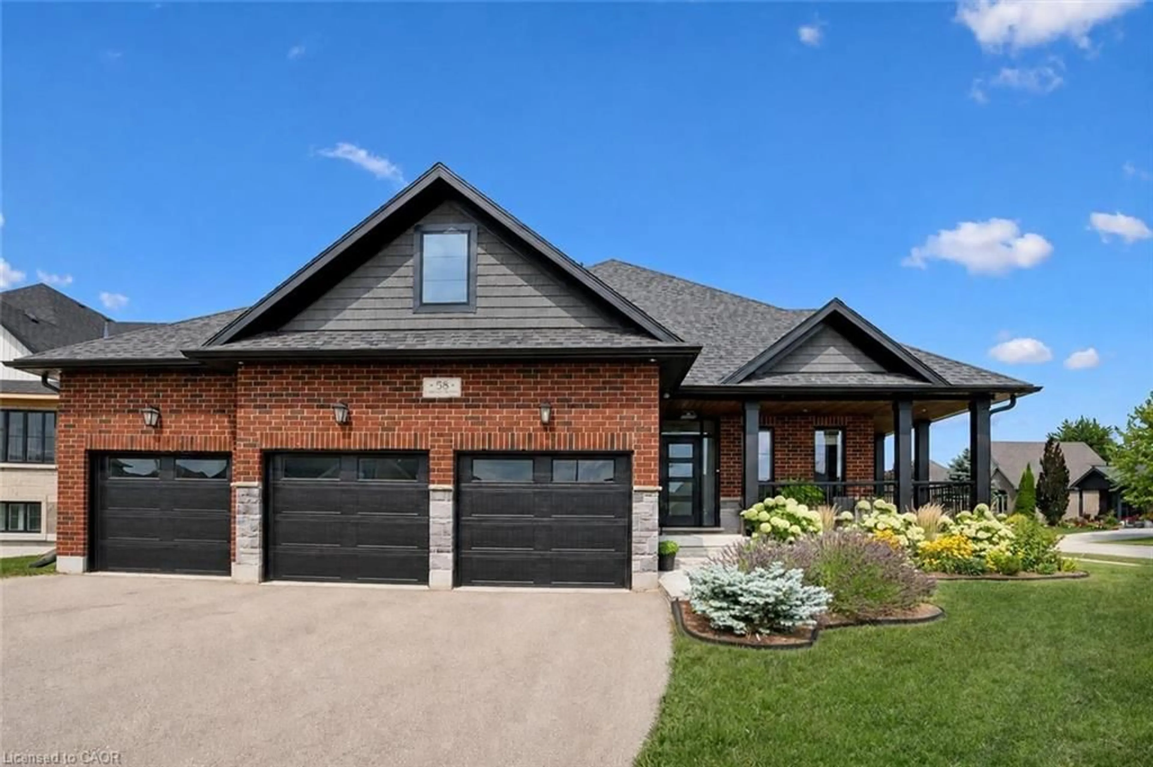 Home with brick exterior material, street for 58 Carriage Cross, Drayton Ontario N0G 1P0