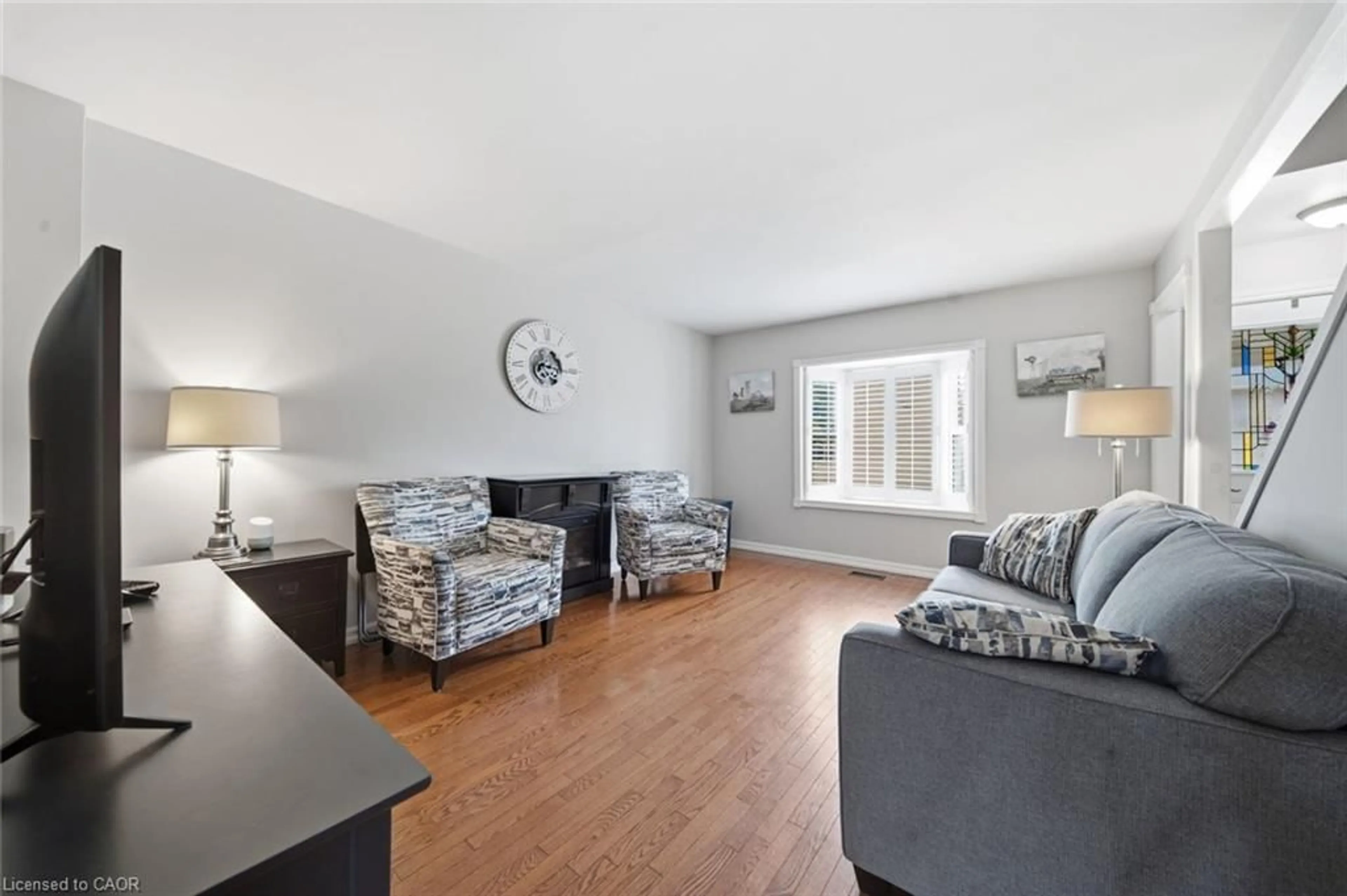 Living room with furniture, wood/laminate floor for 38 Tenth Ave, Brantford Ontario N3S 1E9