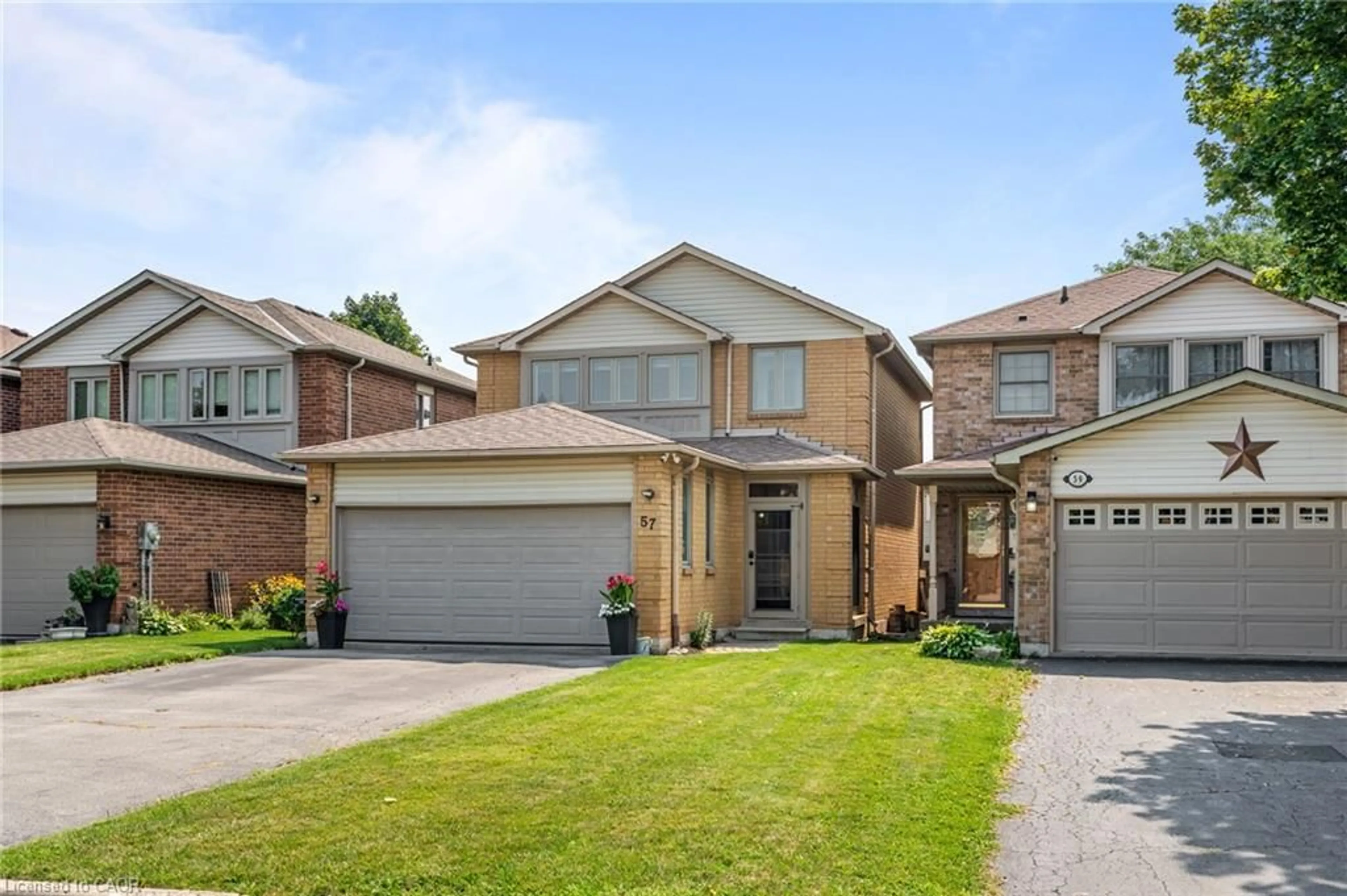 Home with brick exterior material, street for 57 Grindstone Way, Waterdown Ontario L9H 7B5