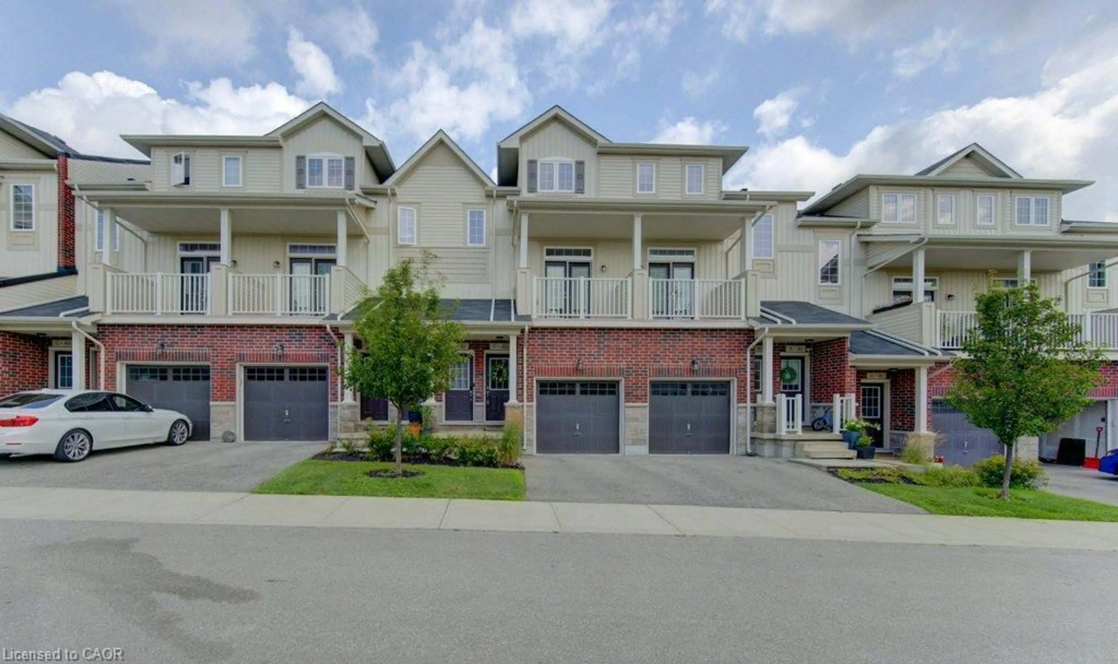 A pic from outside/outdoor area/front of a property/back of a property/a pic from drone, street for 403 Westwood Dr #57, Kitchener Ontario N2M 0B5