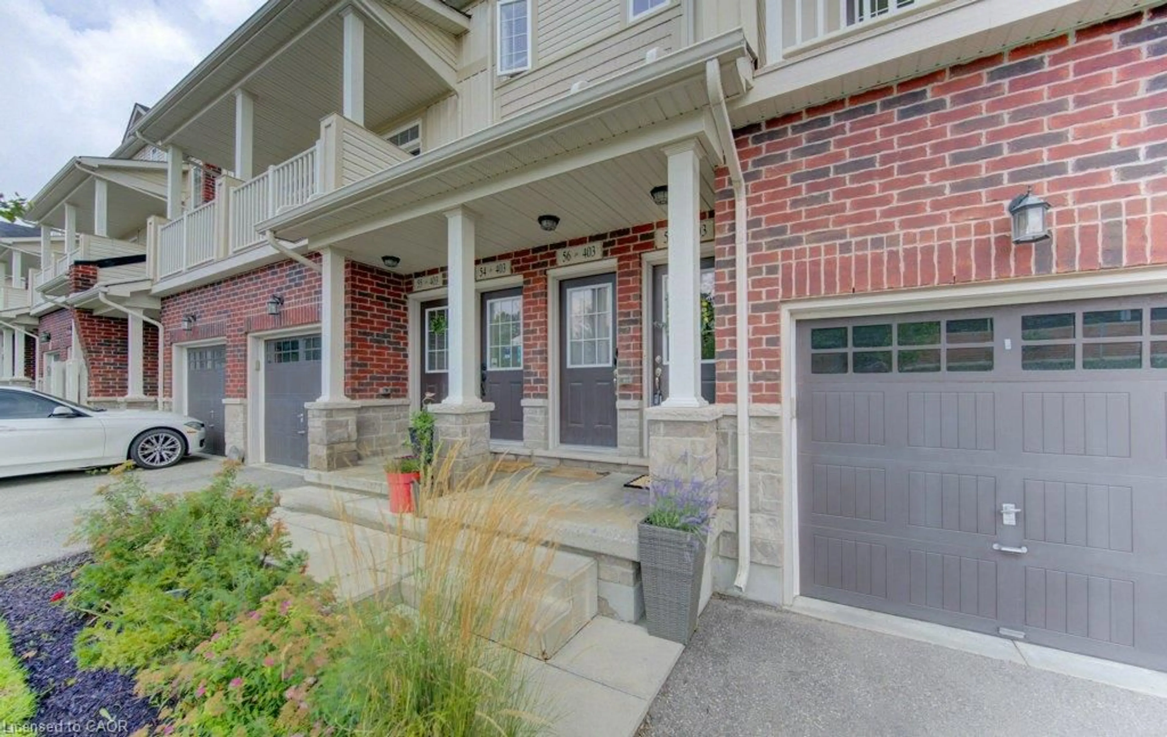 Home with brick exterior material, street for 403 Westwood Dr #57, Kitchener Ontario N2M 0B5
