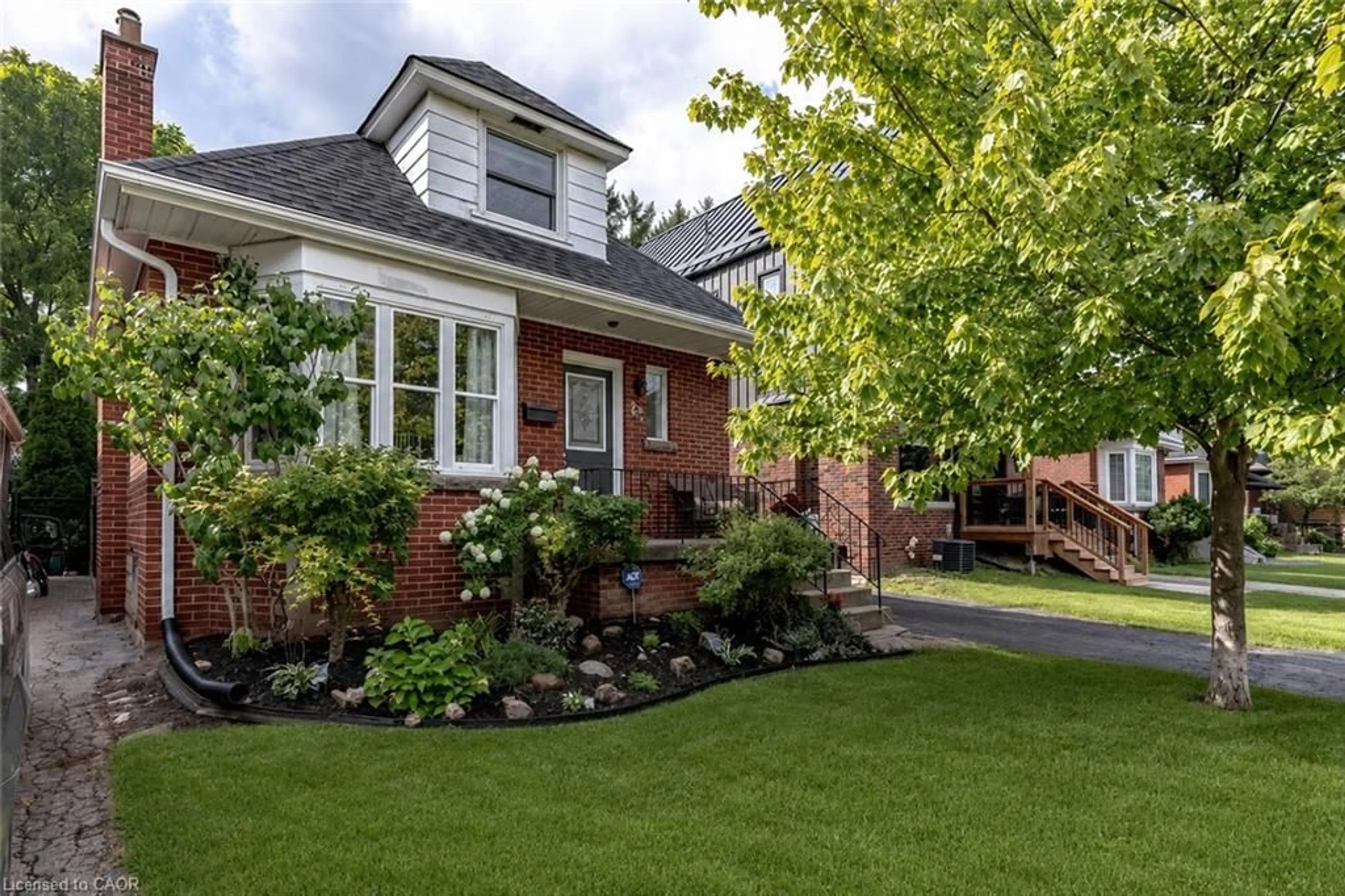 Home with brick exterior material, street for 23 Kipling Rd, Hamilton Ontario L8S 3X2