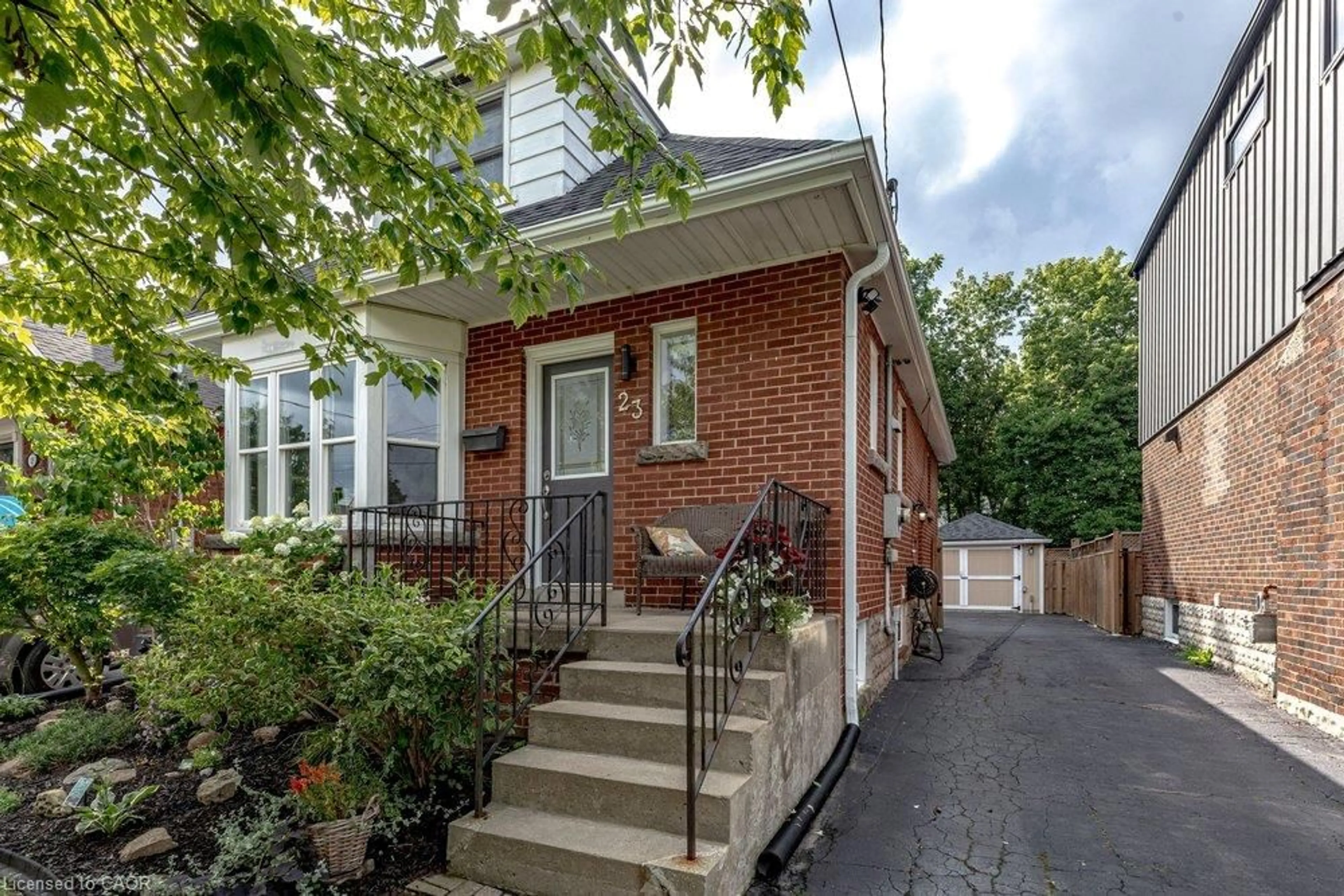 Home with brick exterior material, street for 23 Kipling Rd, Hamilton Ontario L8S 3X2