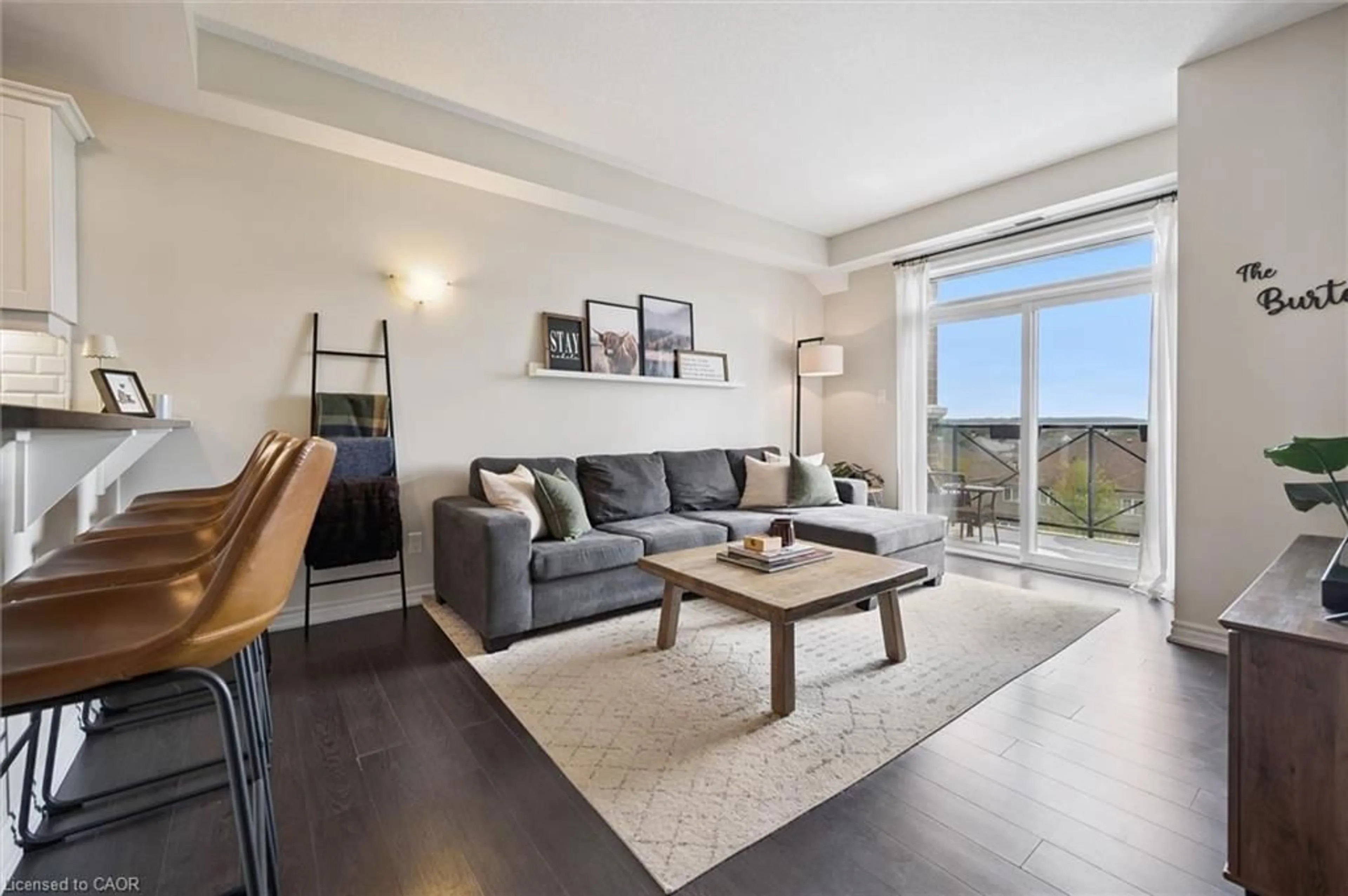 Living room with furniture, wood/laminate floor for 2 Colonial Dr #403, Guelph Ontario N1L 0K8