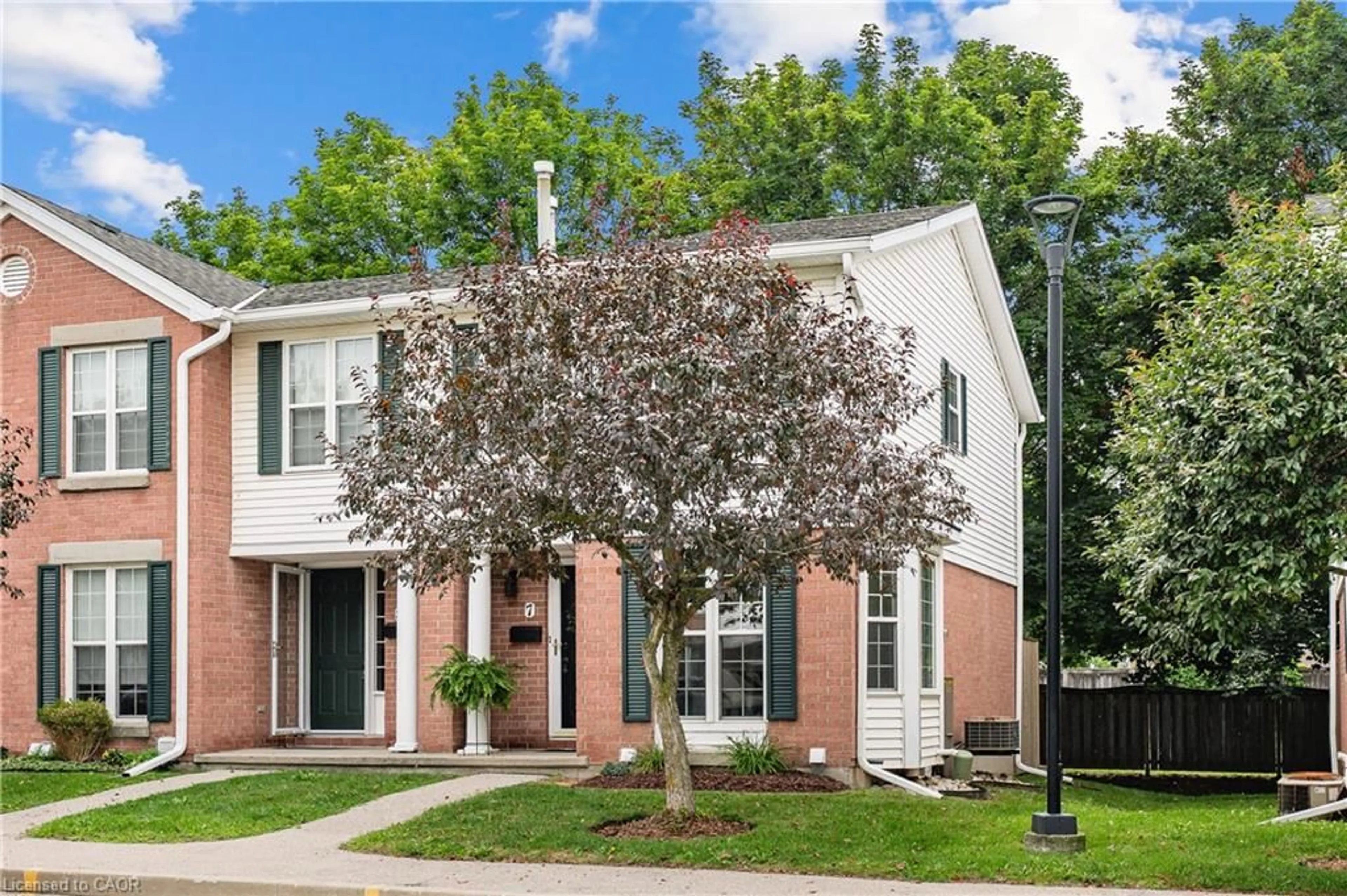 Home with brick exterior material, street for 465 Woolwich St #7, Waterloo Ontario N2K 3S4