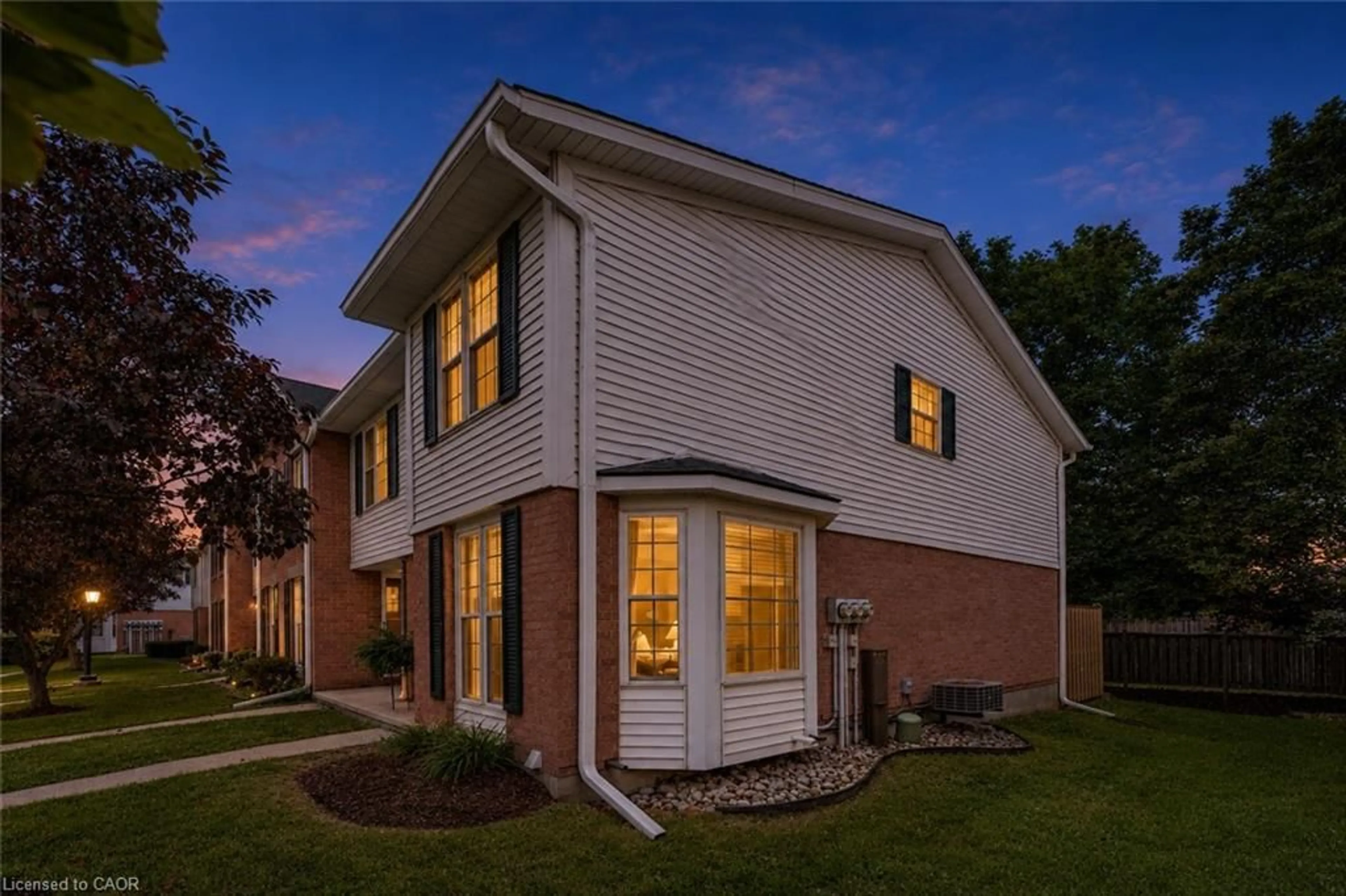 Home with brick exterior material, street for 465 Woolwich St #7, Waterloo Ontario N2K 3S4
