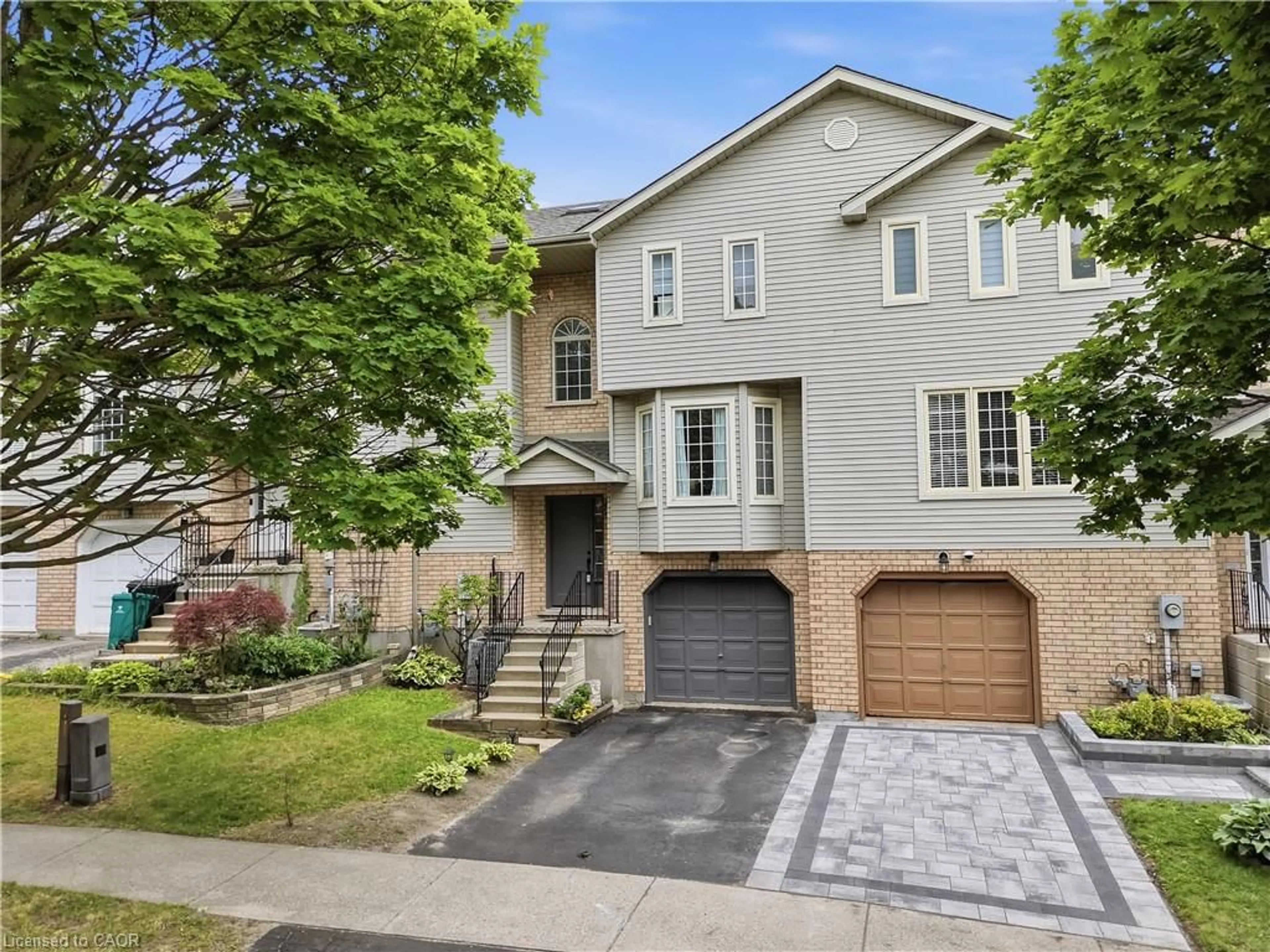 Home with brick exterior material, street for 692 Grange Cres, Waterloo Ontario N2T 2L8