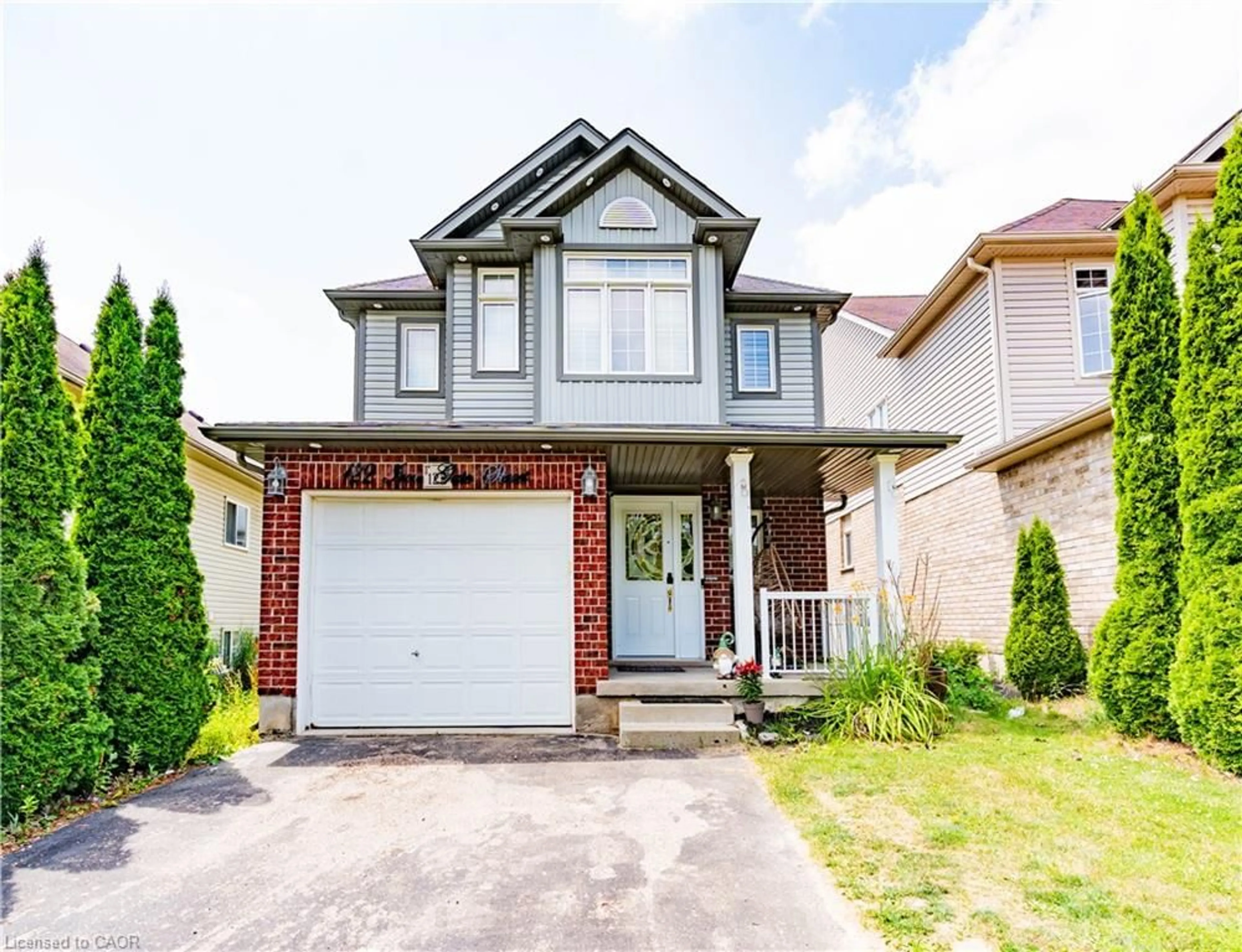 Home with vinyl exterior material, street for 122 Iron Gate St, Kitchener Ontario N2N 3R4