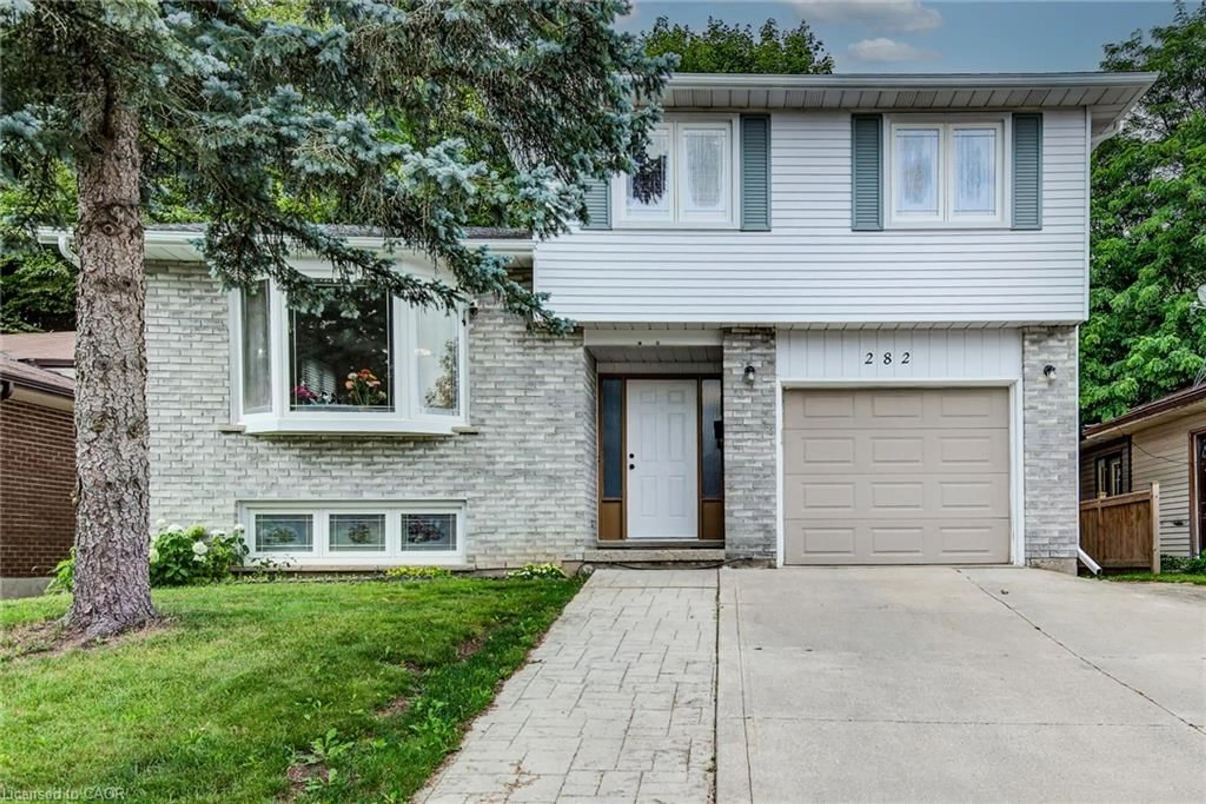Home with brick exterior material, street for 282 Driftwood Dr, Kitchener Ontario N2N 1X6