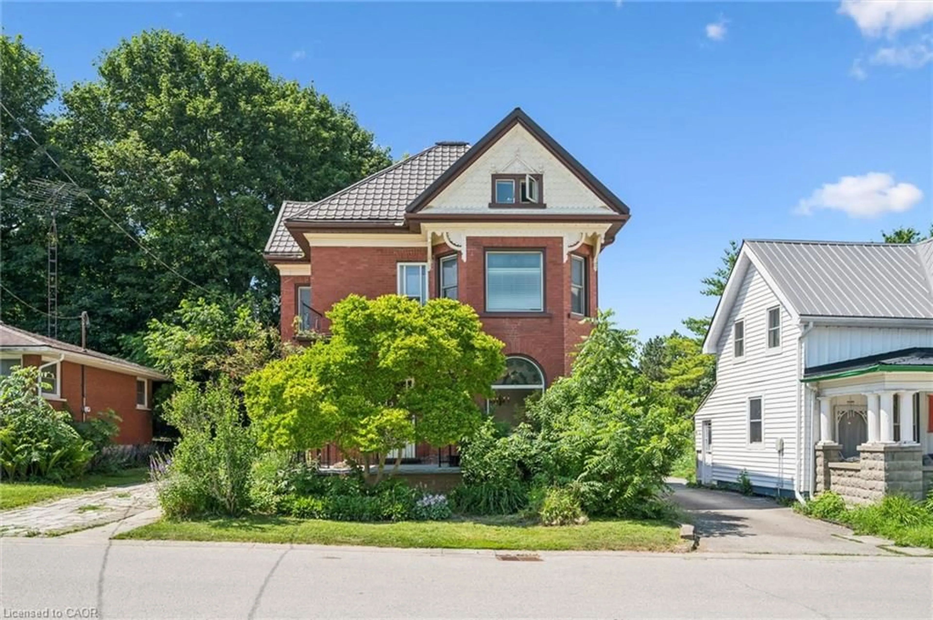 Home with brick exterior material, street for 5 West St, Milverton Ontario N0K 1M0