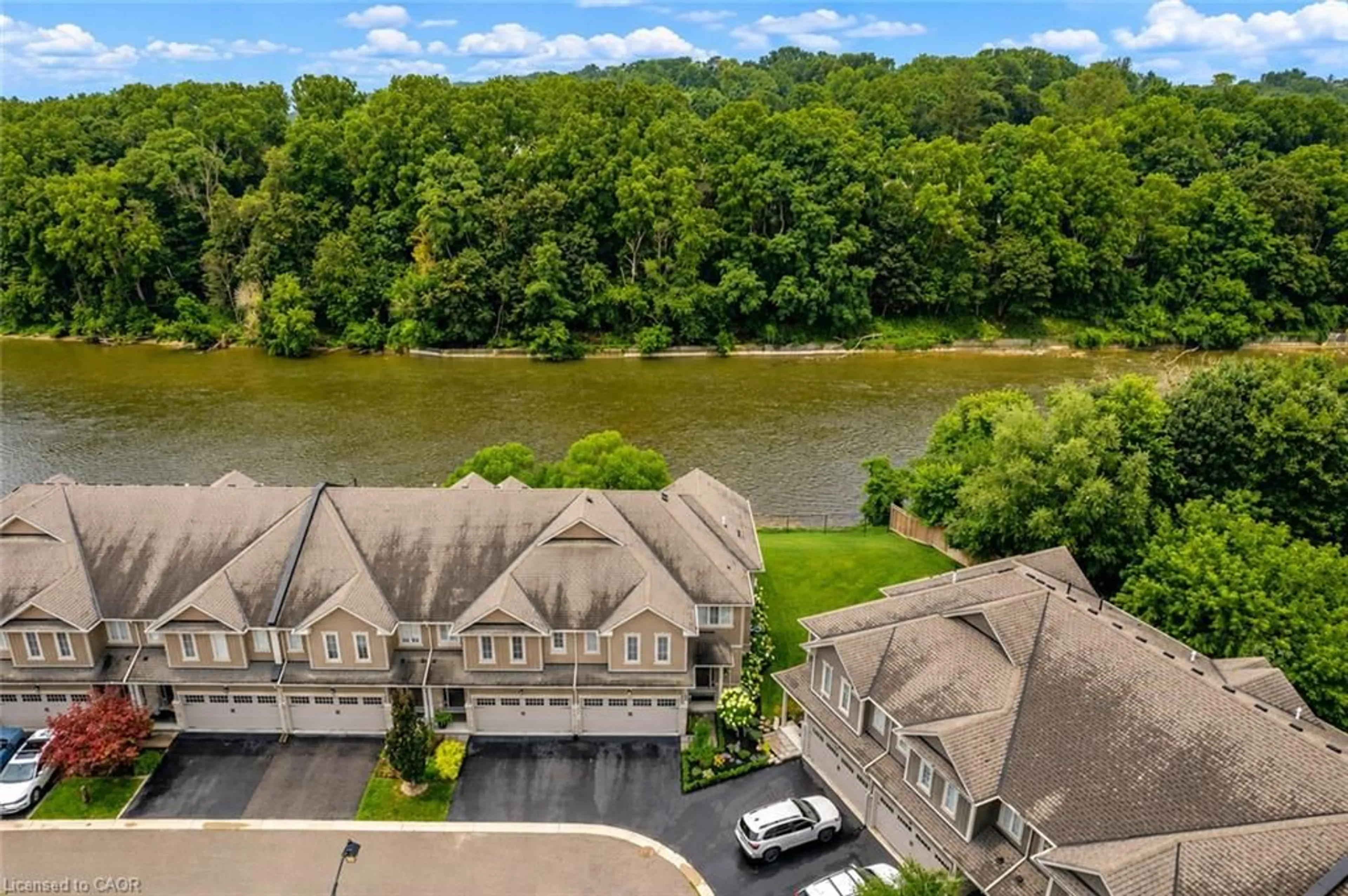 A pic from outside/outdoor area/front of a property/back of a property/a pic from drone, water/lake/river/ocean view for 80 Willow St #21, Paris Ontario N3L 2K6