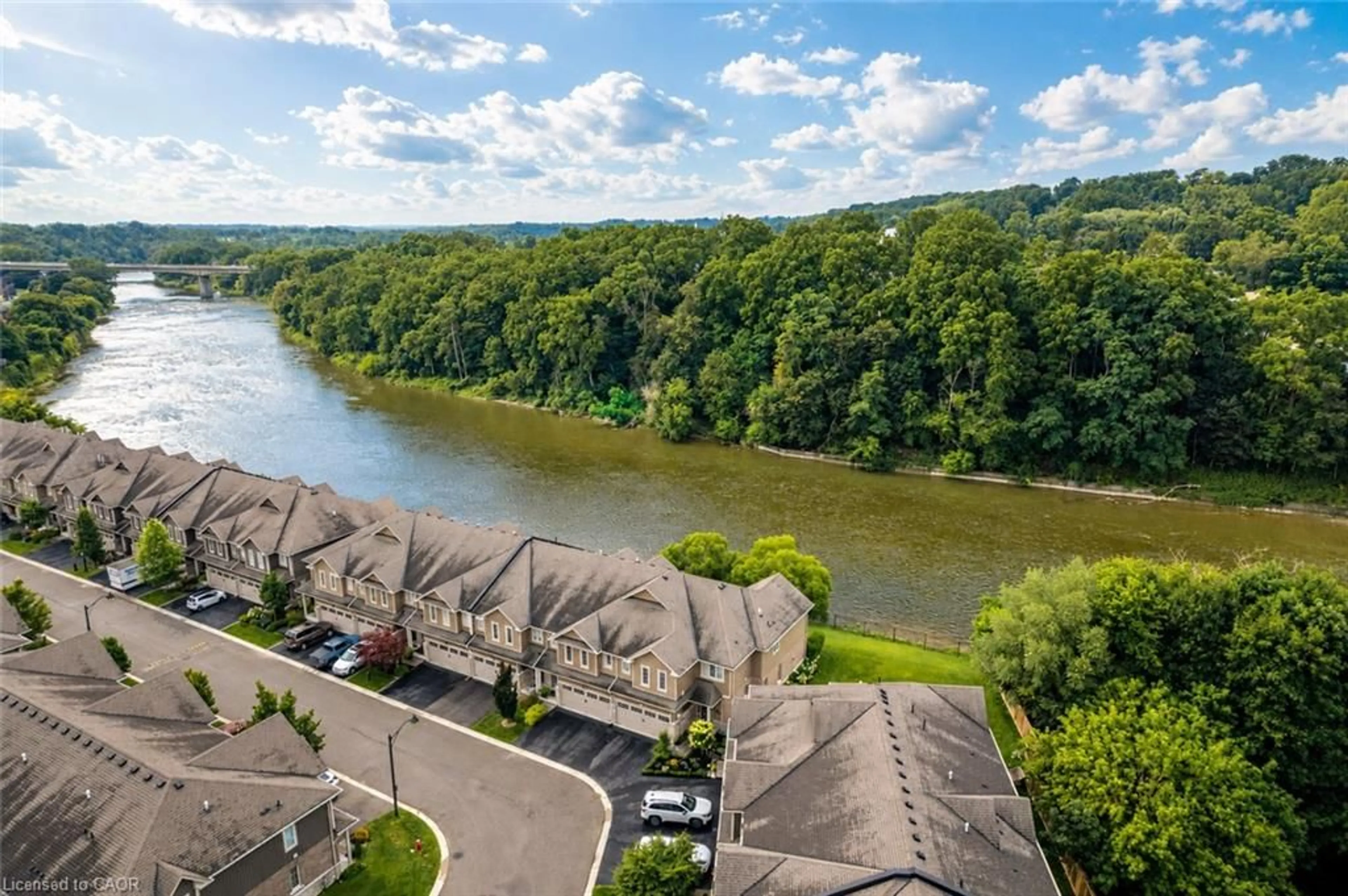A pic from outside/outdoor area/front of a property/back of a property/a pic from drone, water/lake/river/ocean view for 80 Willow St #21, Paris Ontario N3L 2K6