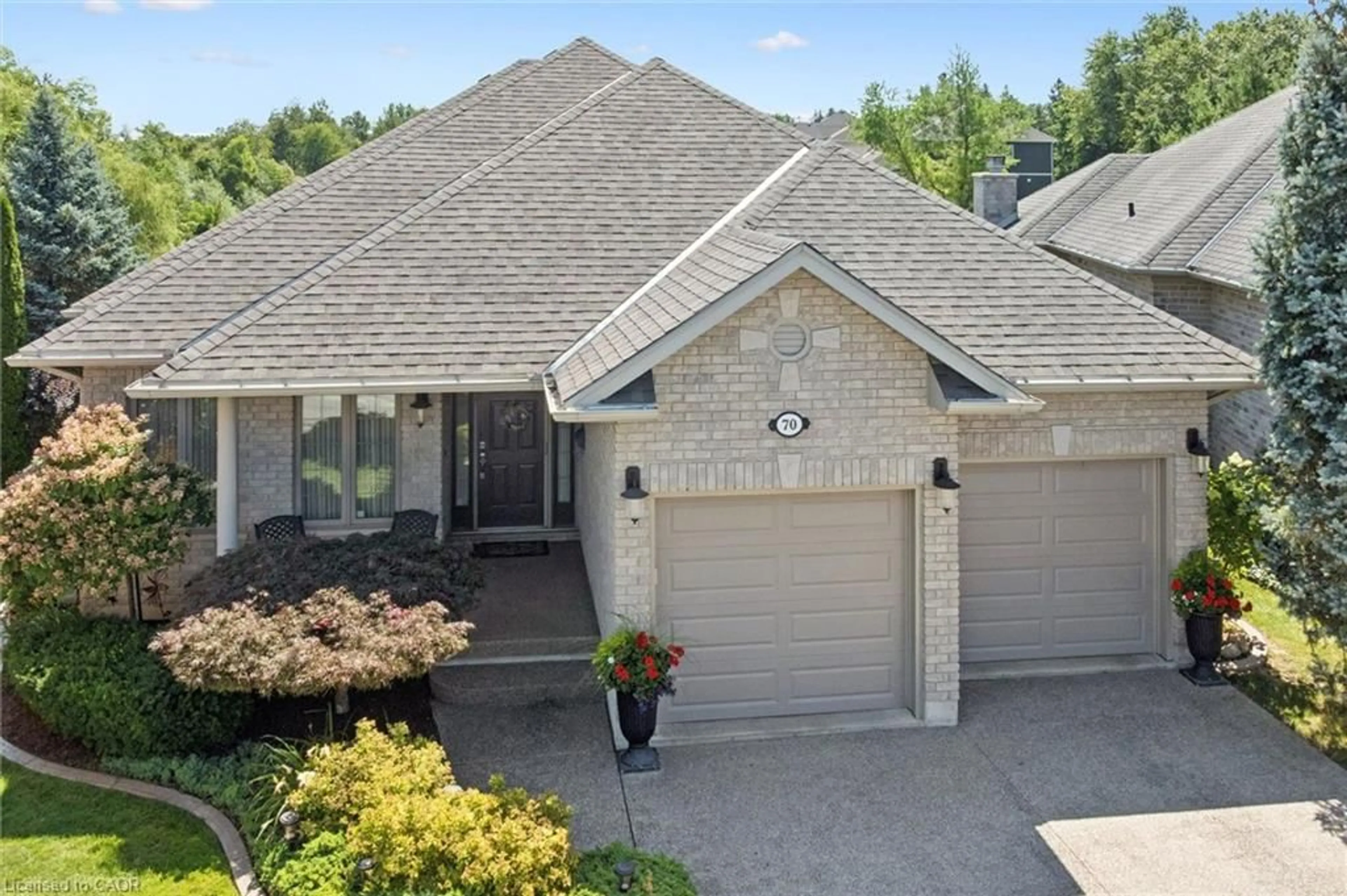Home with brick exterior material, street for 70 Bathgate Dr, Guelph Ontario N1L 1B1