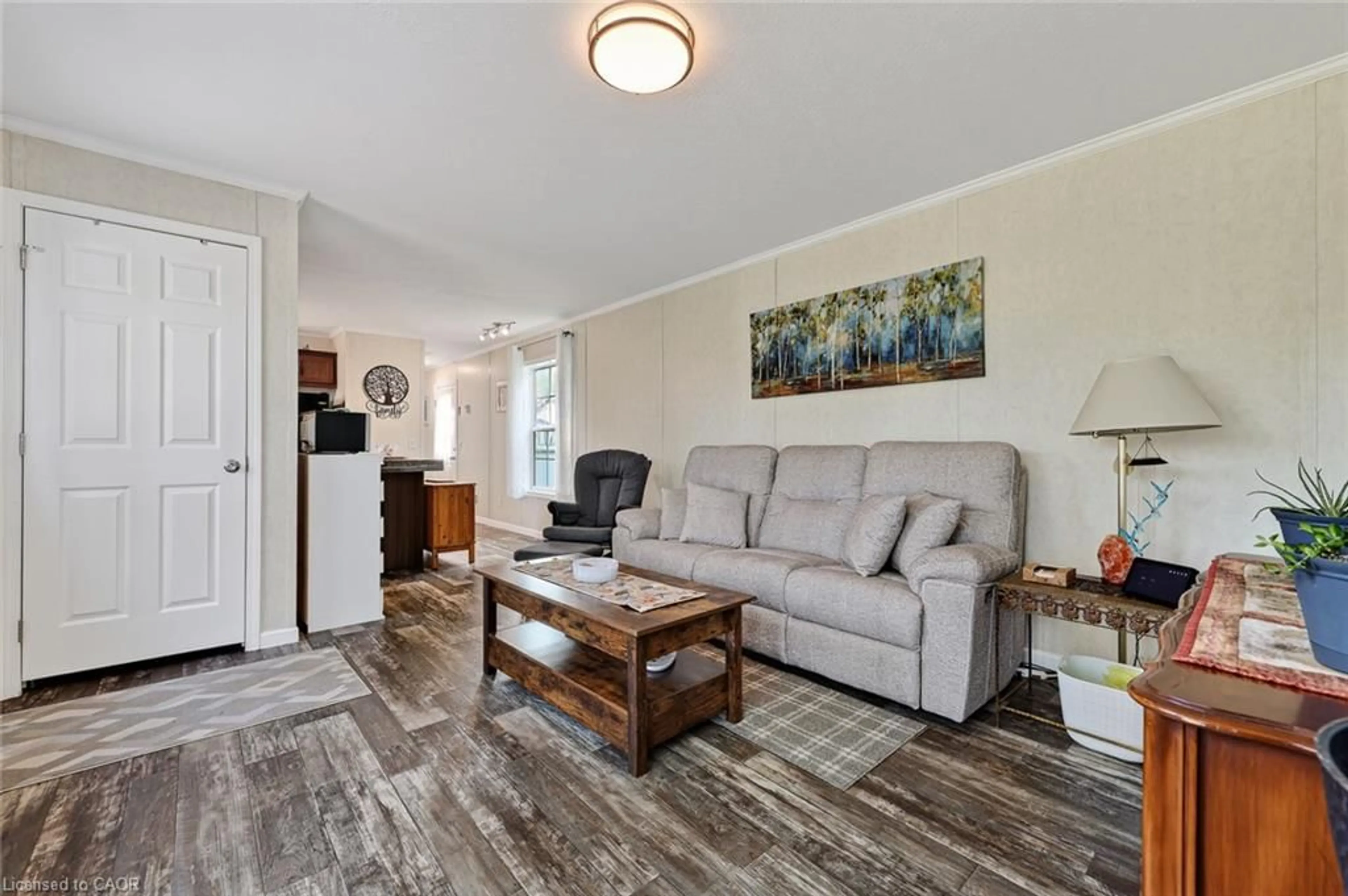 Living room with furniture, wood/laminate floor for 596101 Highway 59 #1 Whylie, East Zorra-Tavistock (Twp) Ontario N4S 7W1