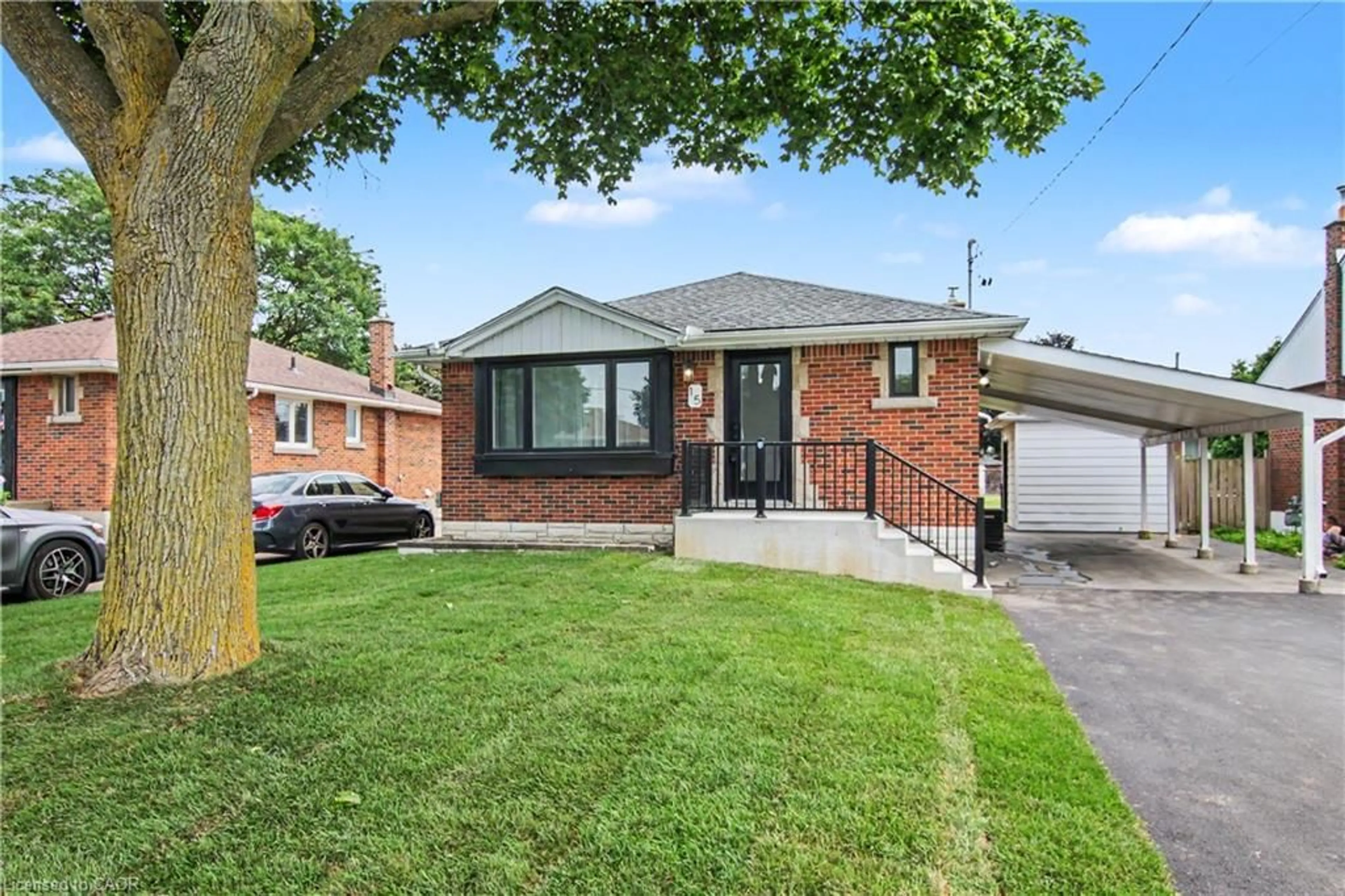 Home with brick exterior material, street for 15 Greenwood St, Hamilton Ontario L8T 3N2