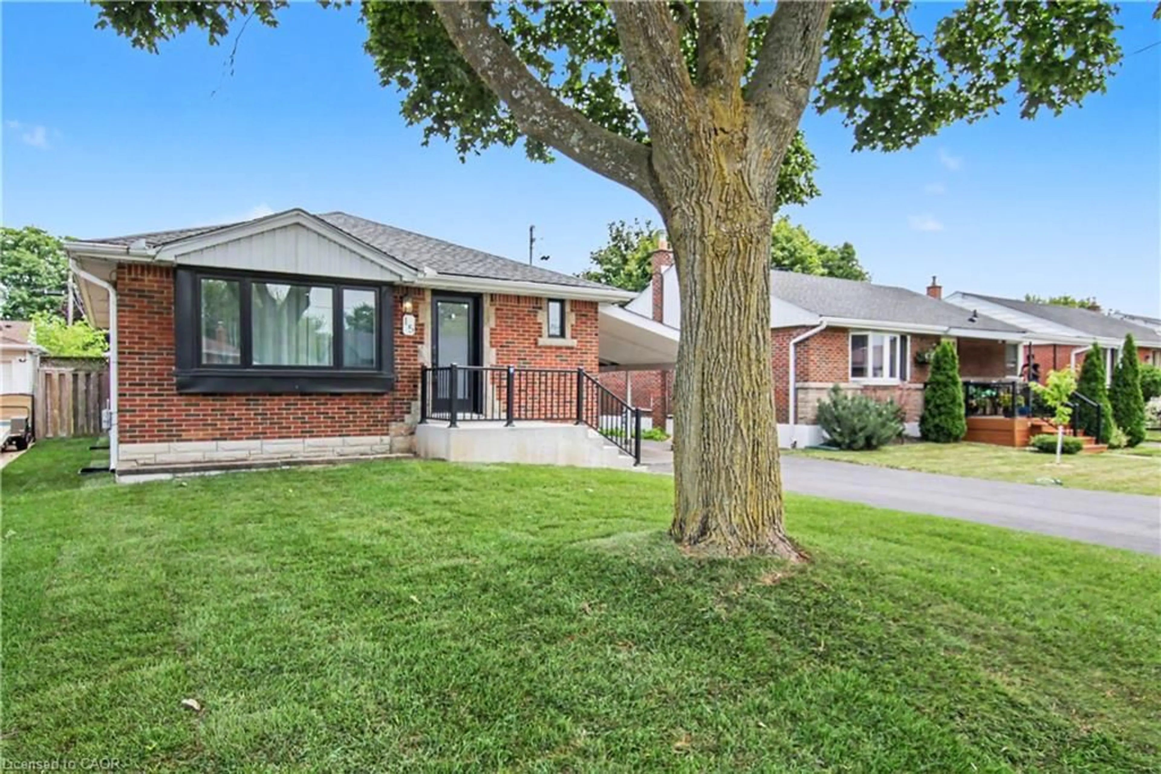 Home with brick exterior material, street for 15 Greenwood St, Hamilton Ontario L8T 3N2