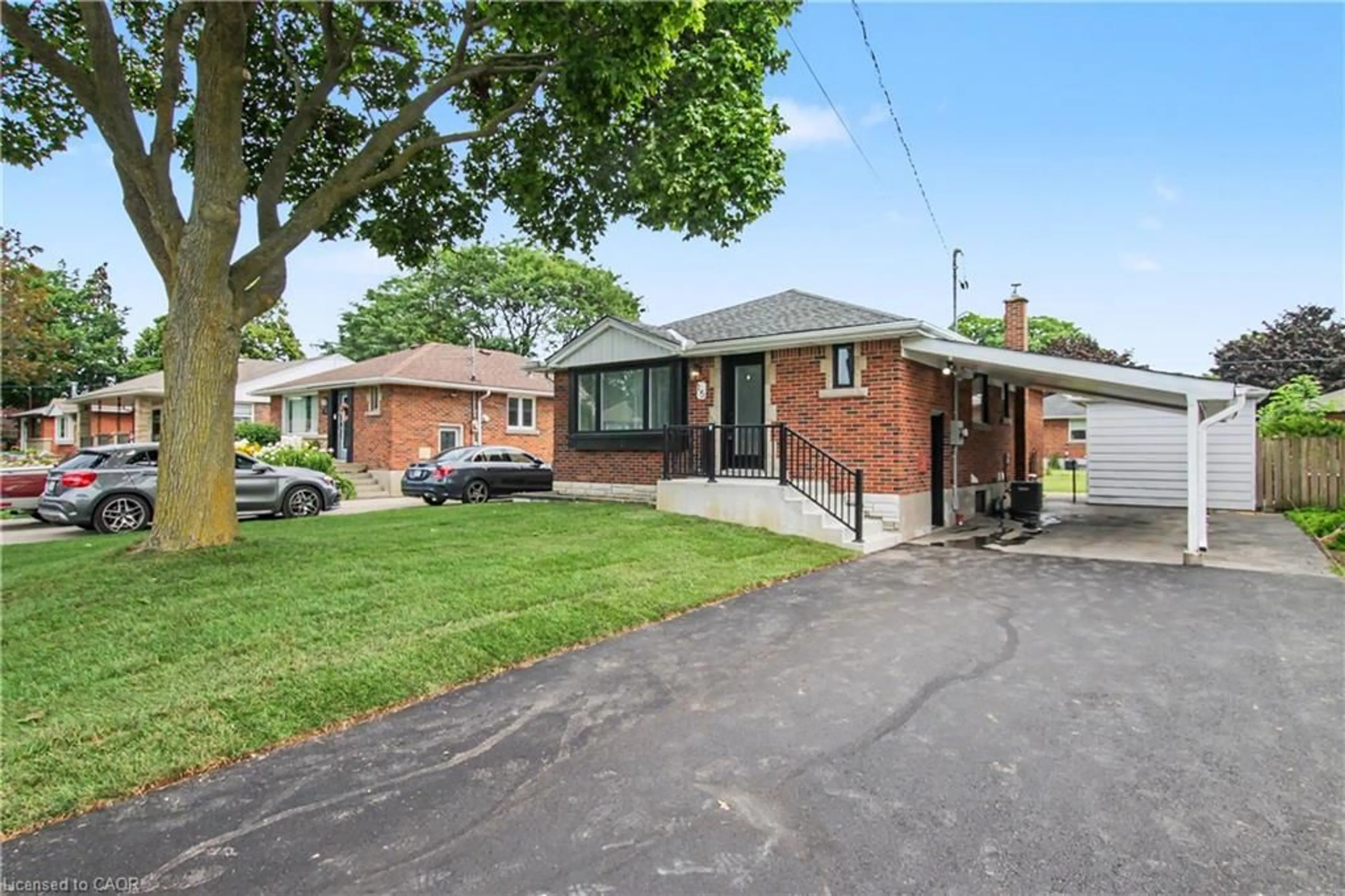 Home with brick exterior material, street for 15 Greenwood St, Hamilton Ontario L8T 3N2
