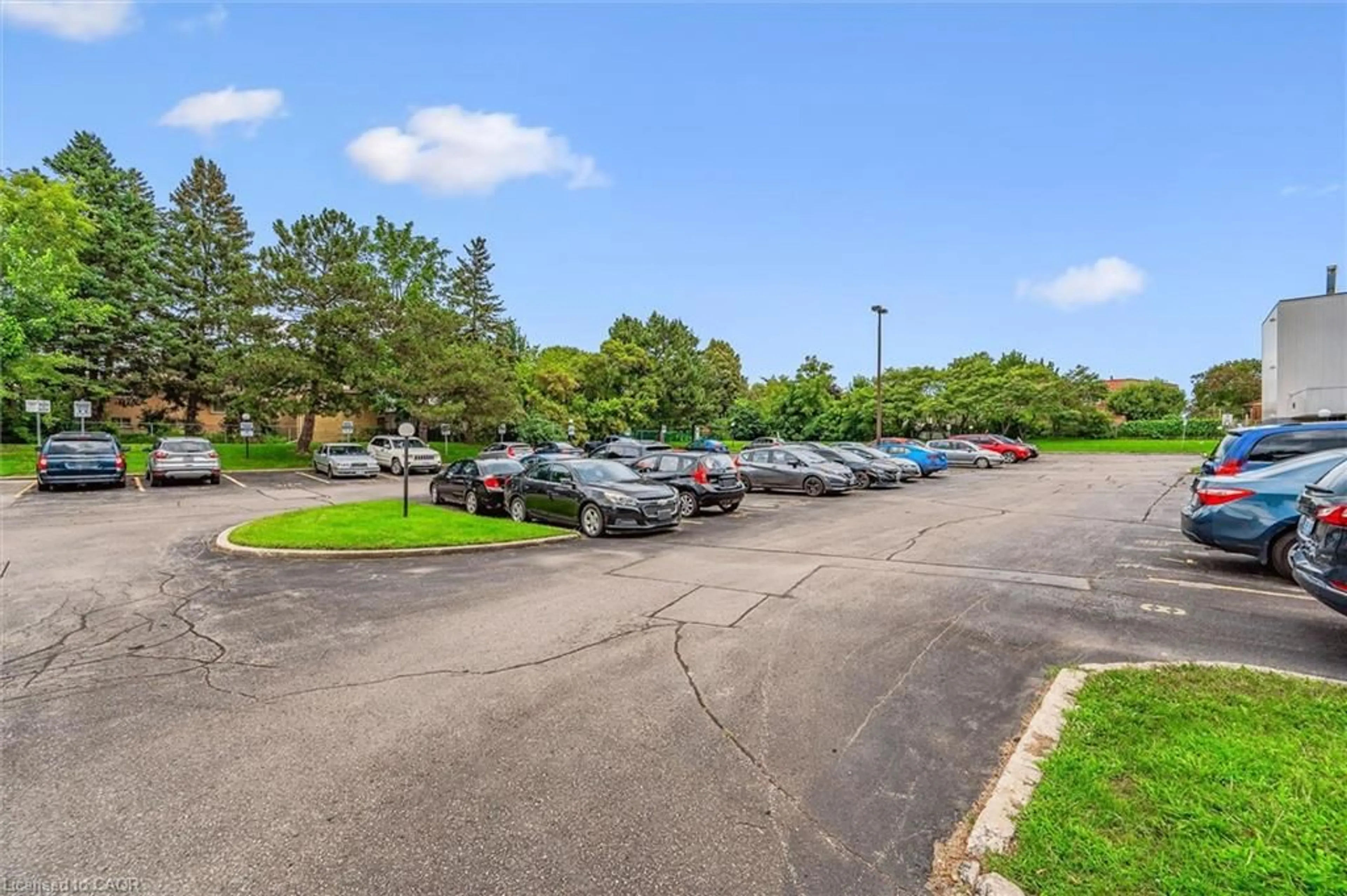 A pic from outside/outdoor area/front of a property/back of a property/a pic from drone, unknown for 65 Silvercreek Pky #404, Guelph Ontario N1H 7R9