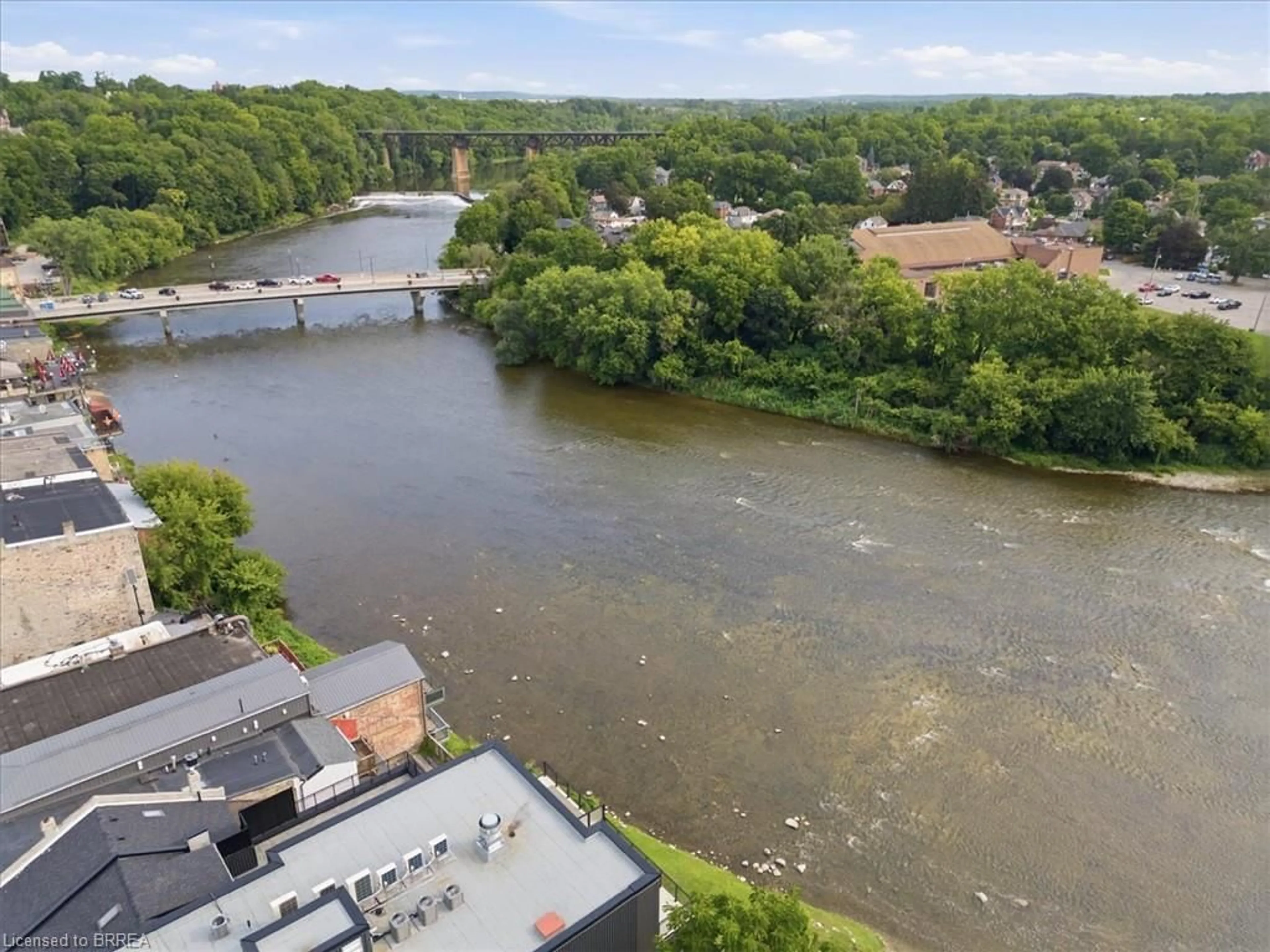 A pic from outside/outdoor area/front of a property/back of a property/a pic from drone, water/lake/river/ocean view for 7 Grand River St #202, Paris Ontario N3L 2L9