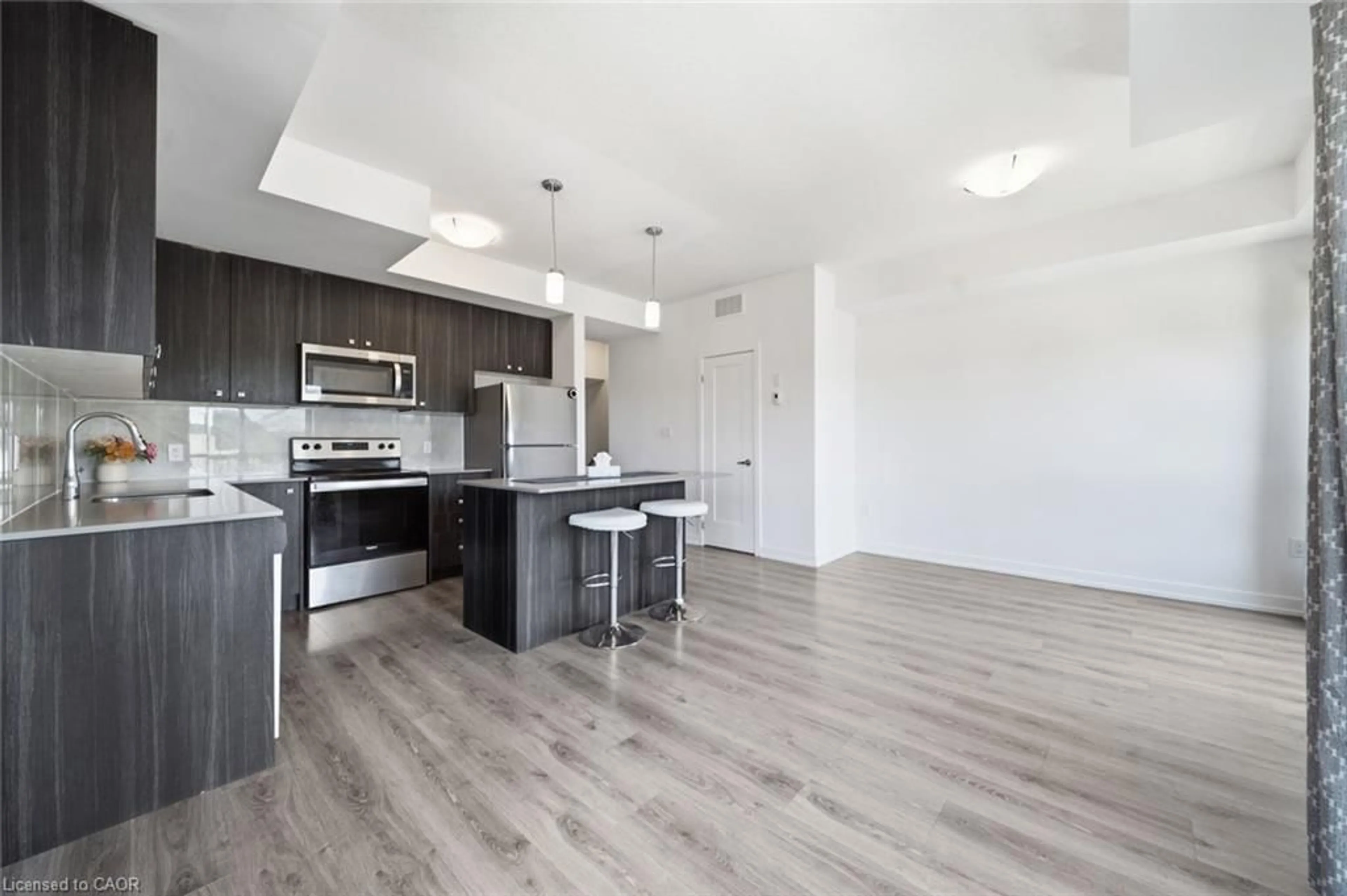 Open concept kitchen, wood/laminate floor for 10 Palace St #B12, Kitchener Ontario N2E 0J3