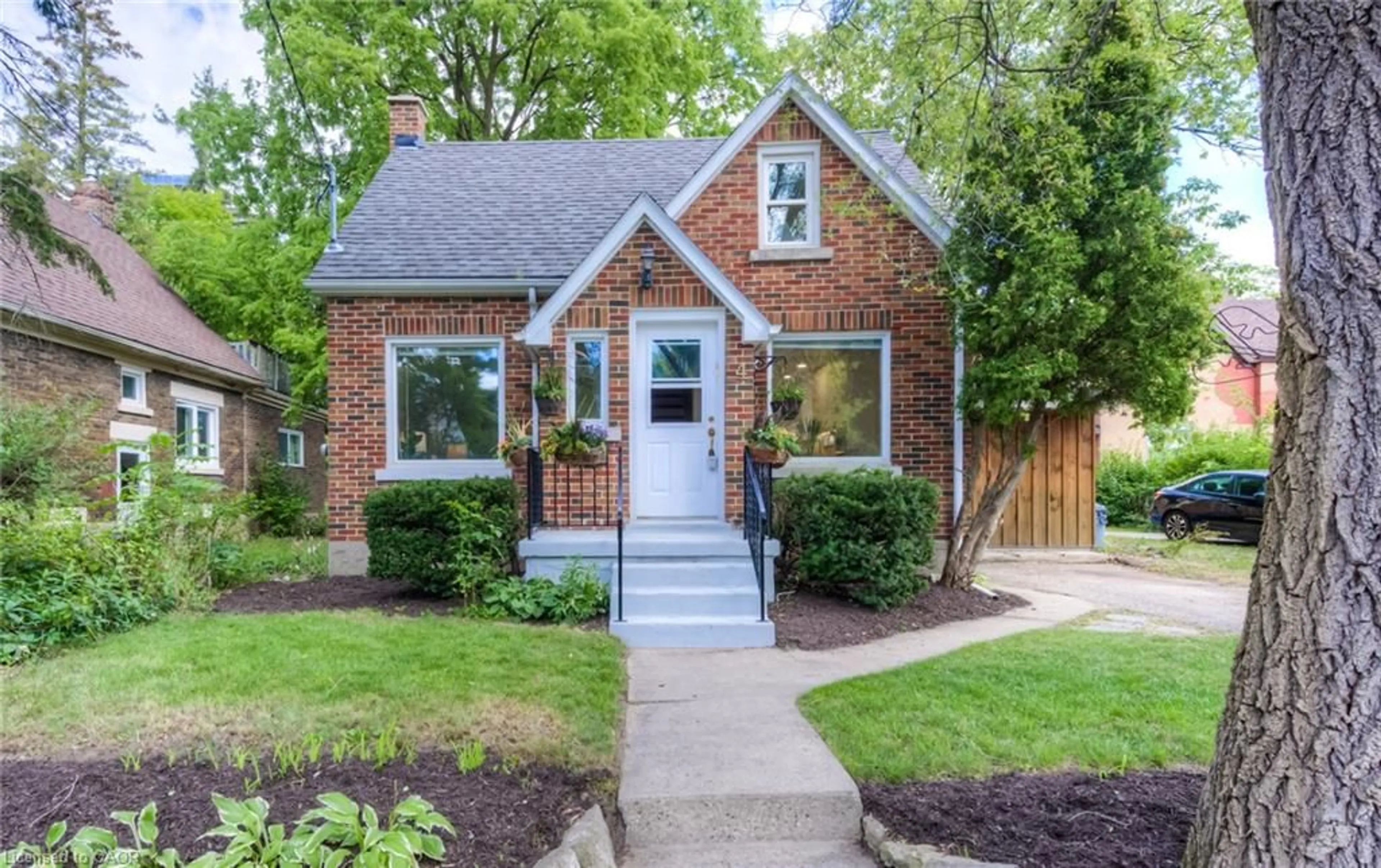 Home with brick exterior material, street for 4 Dunbar Rd, Waterloo Ontario N2L 2C7