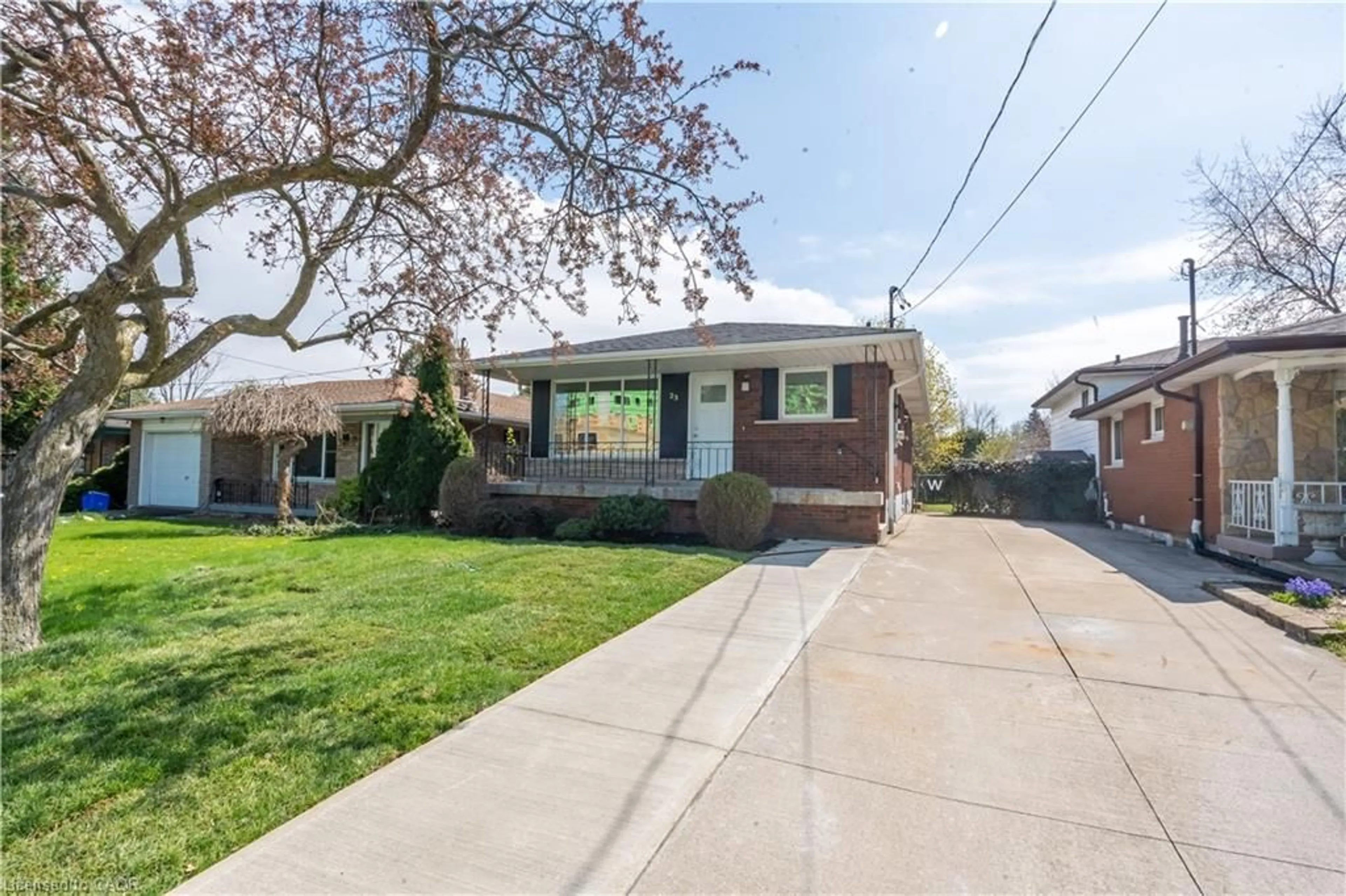 Home with brick exterior material, street for 23 Tyrone Dr, Hamilton Ontario L9C 2M6