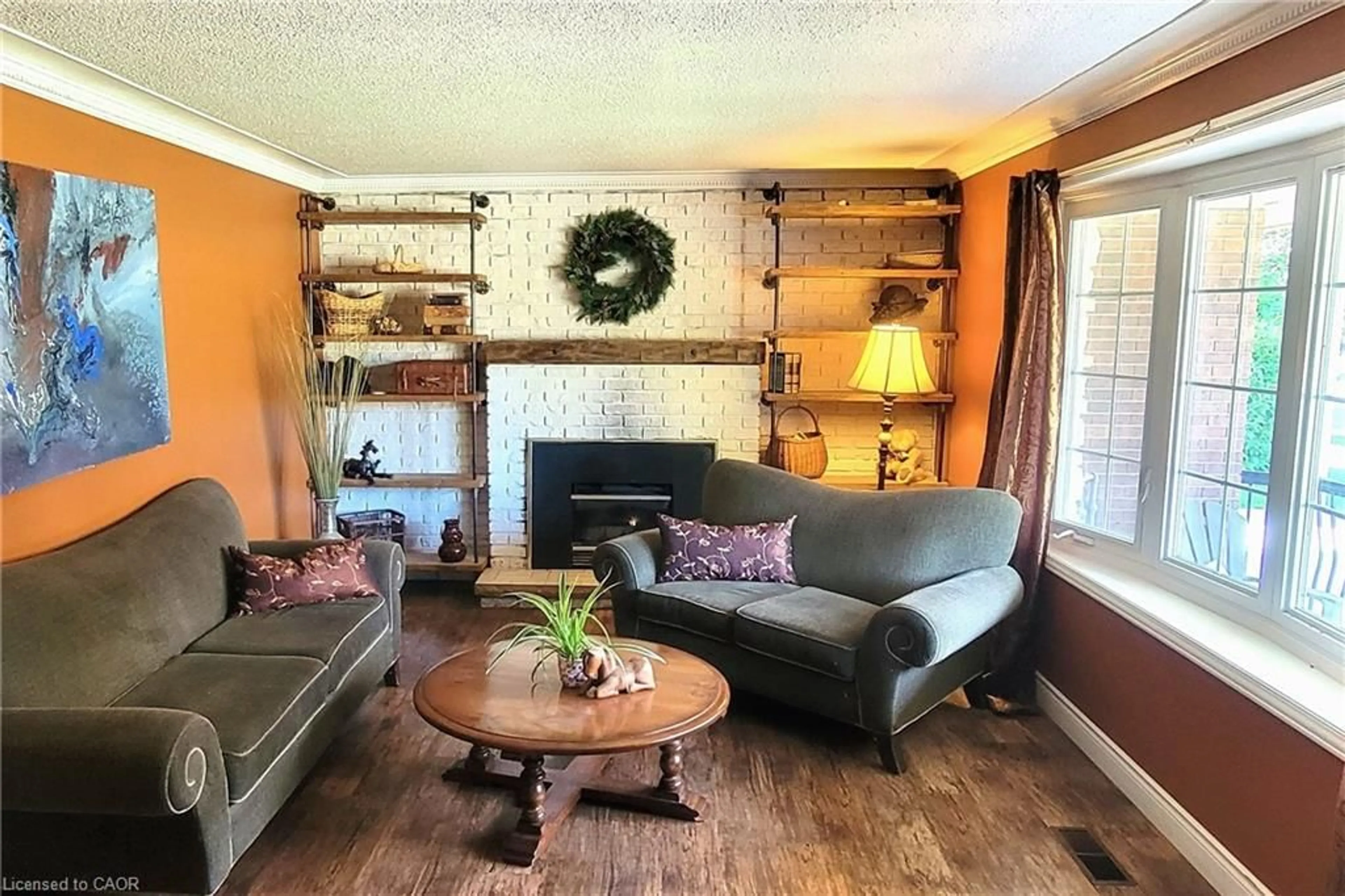 Living room with furniture, wood/laminate floor for 115 Southwood Dr, Cambridge Ontario N1S 3S3