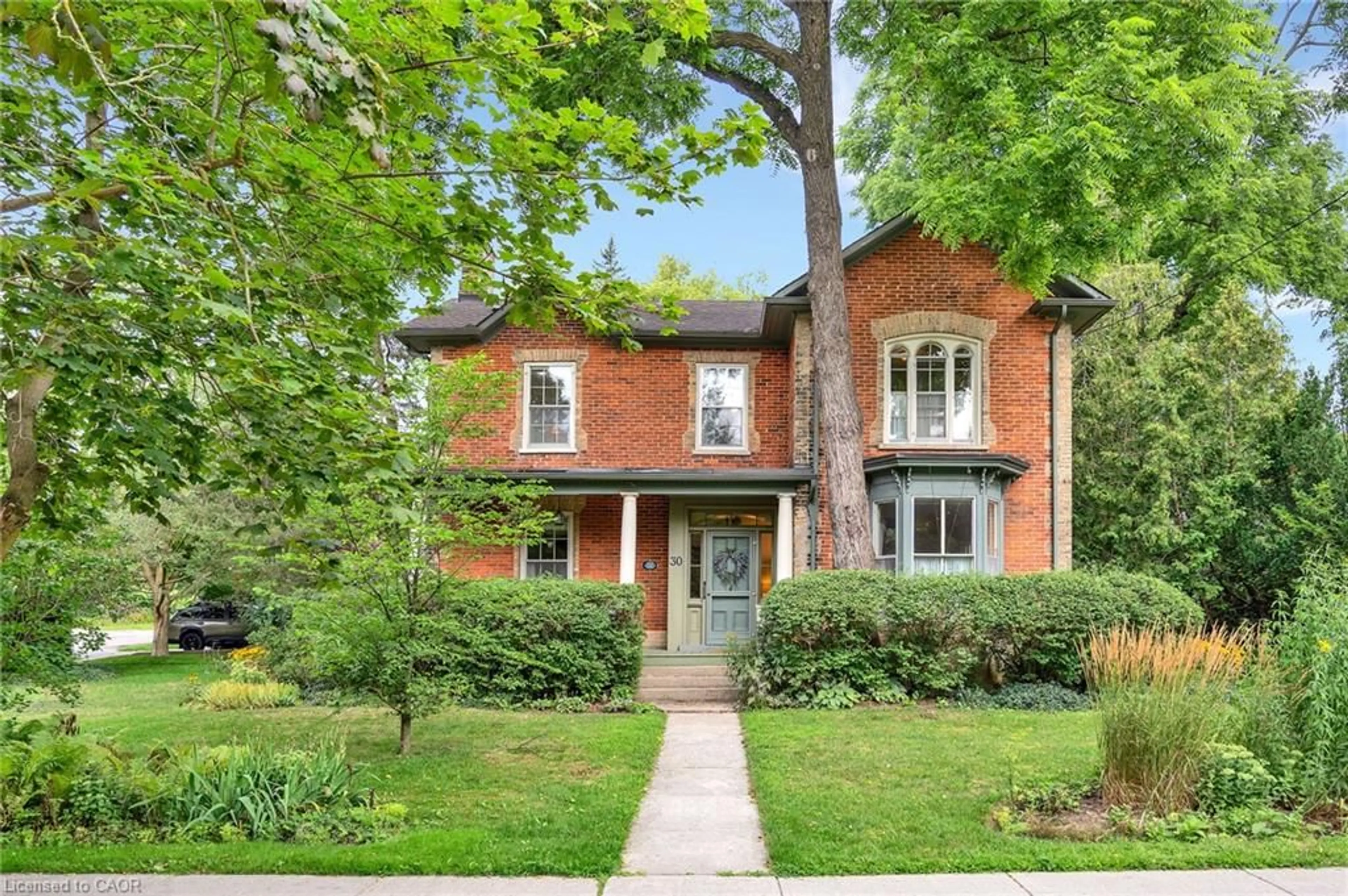 Home with brick exterior material, street for 30 Moir St, Elora Ontario N0B 1S0