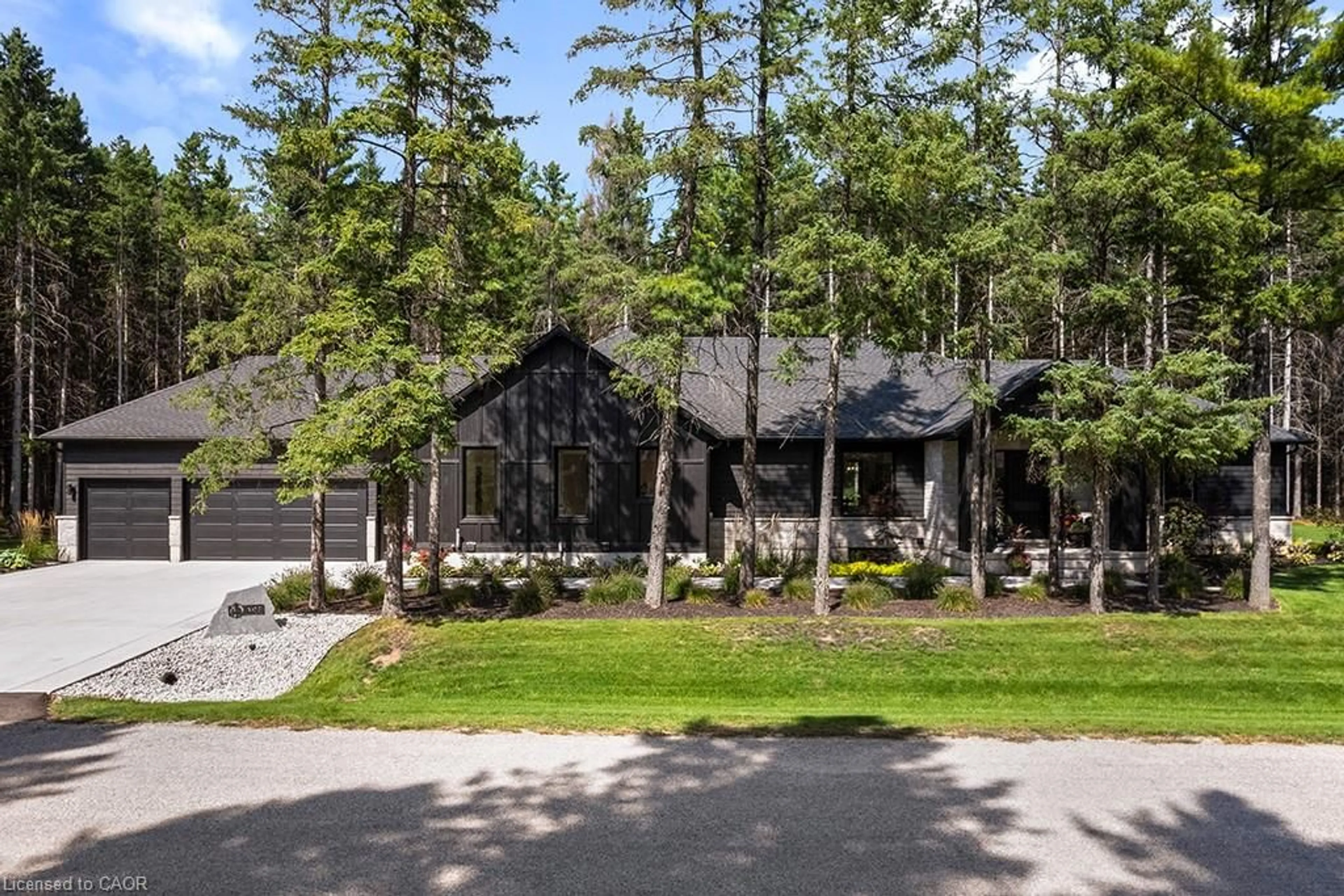 A pic from outside/outdoor area/front of a property/back of a property/a pic from drone, forest/trees view for 107 Louise Creek Cres, West Grey Ontario N0G 1S0