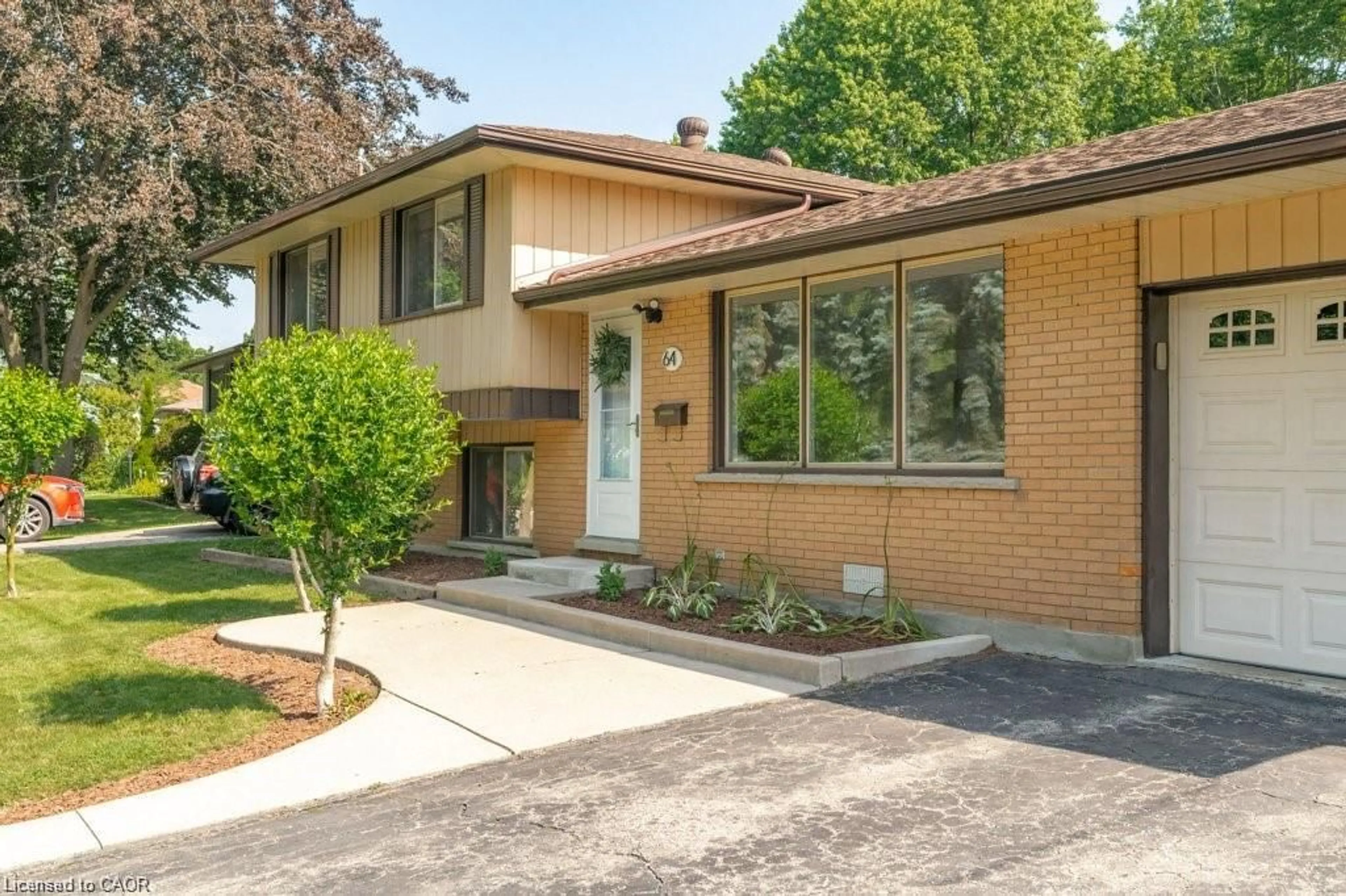 Home with brick exterior material, street for 64 Warren Rd, Kitchener Ontario N2M 4T4