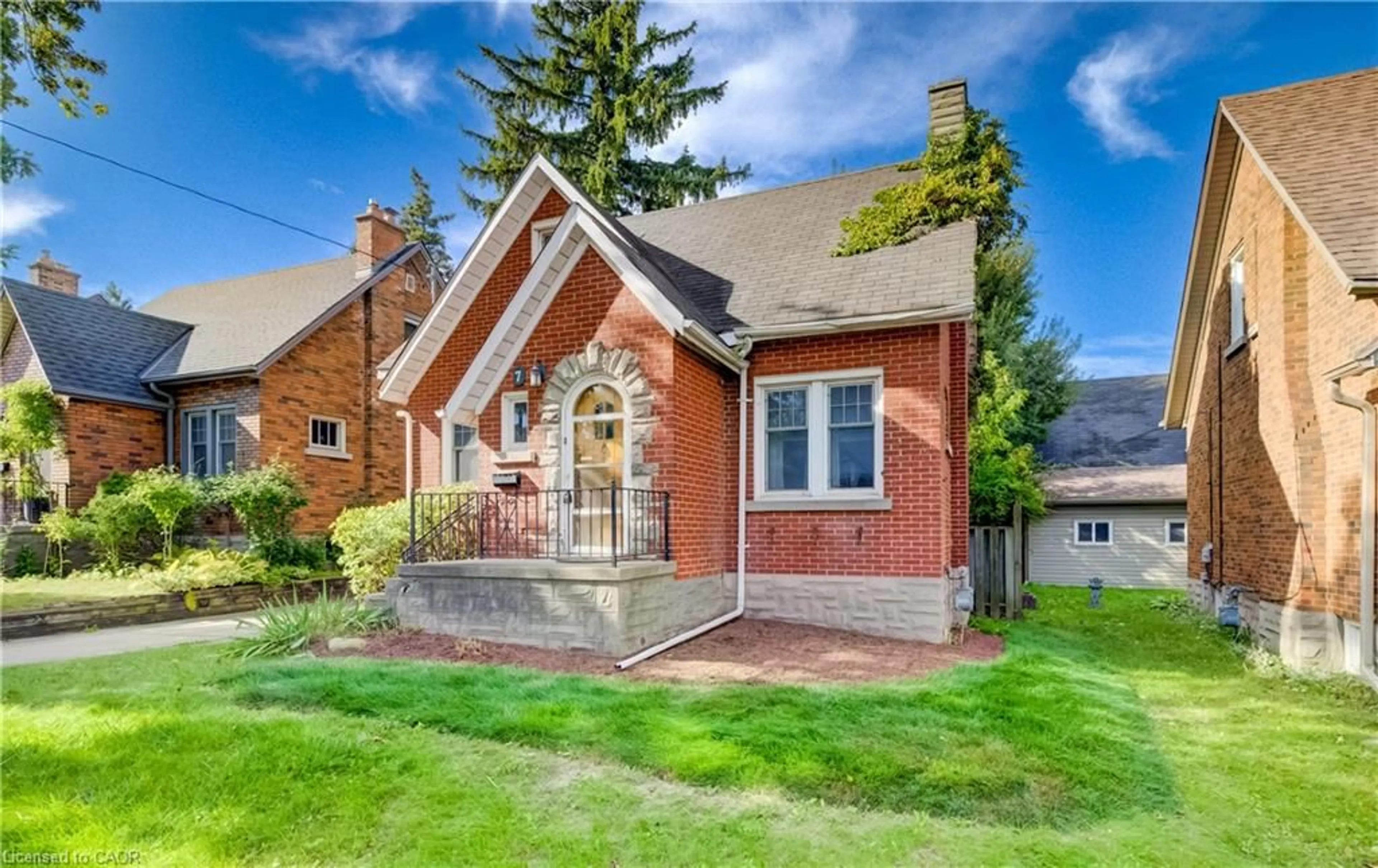 Home with brick exterior material, street for 7 Locust St, Kitchener Ontario N2H 1W6