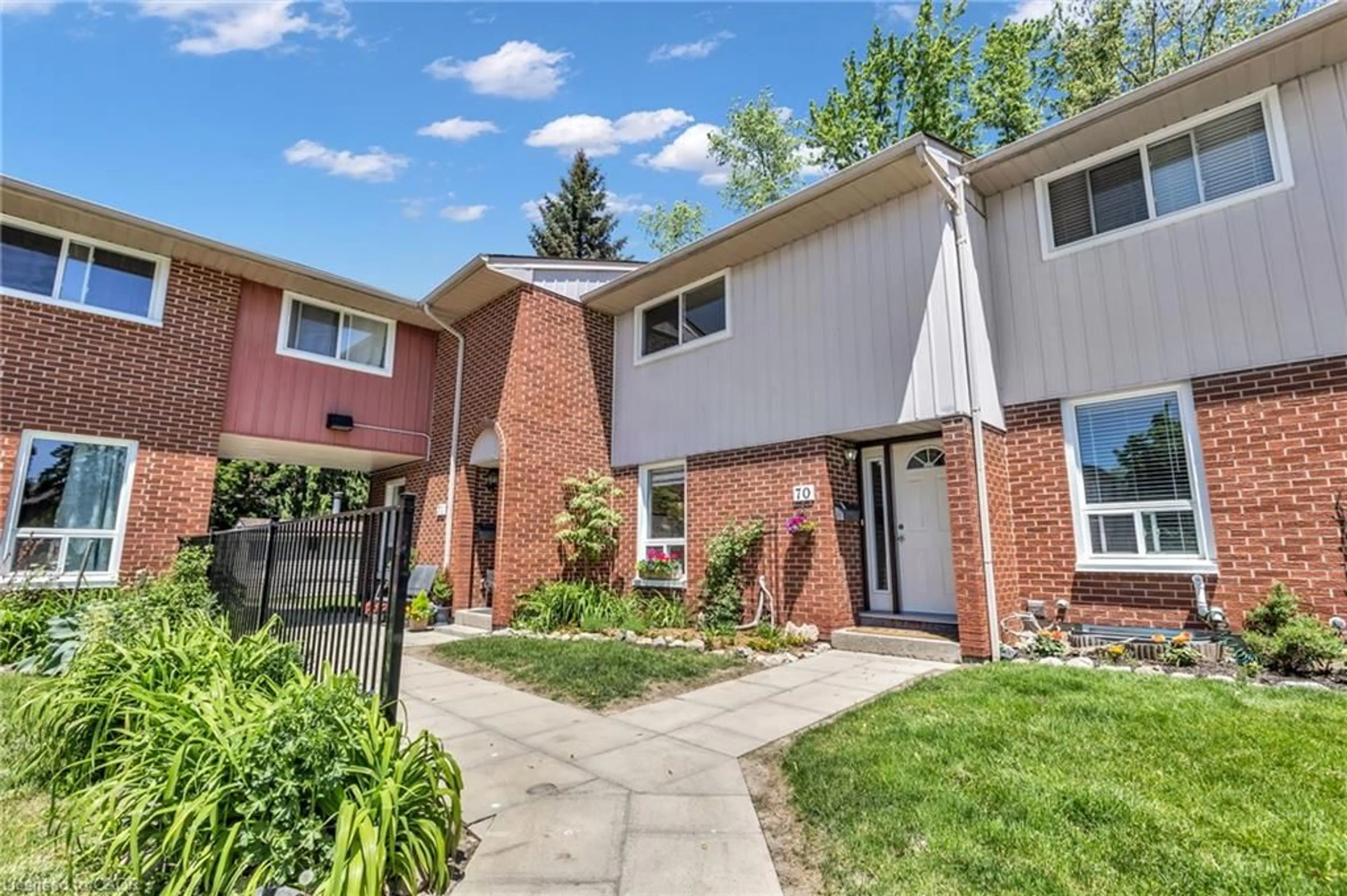 Home with brick exterior material, street for 49 Rhonda Rd #70, Guelph Ontario N1H 7A4