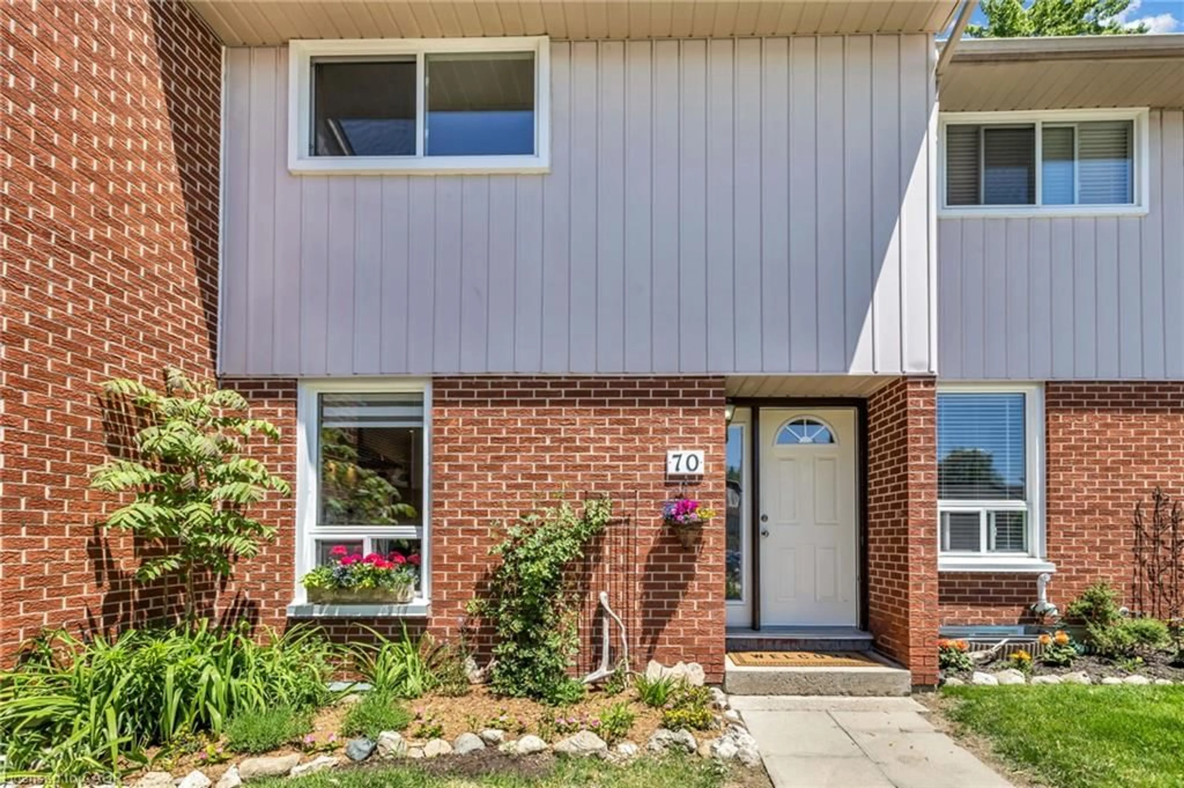 Home with brick exterior material, street for 49 Rhonda Rd #70, Guelph Ontario N1H 7A4