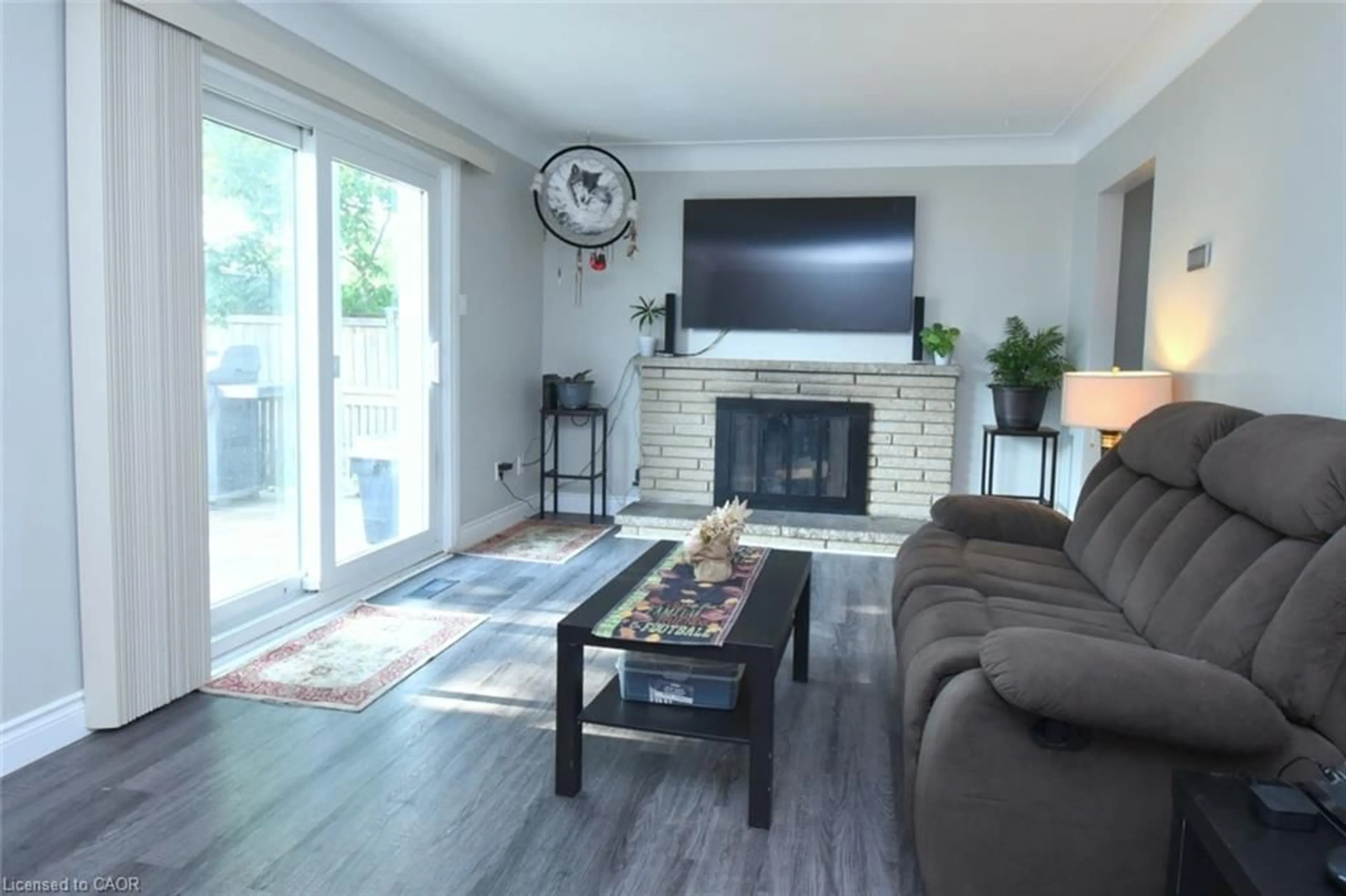 Living room with furniture, wood/laminate floor for 57 East 31st St, Hamilton Ontario L8V 3N8