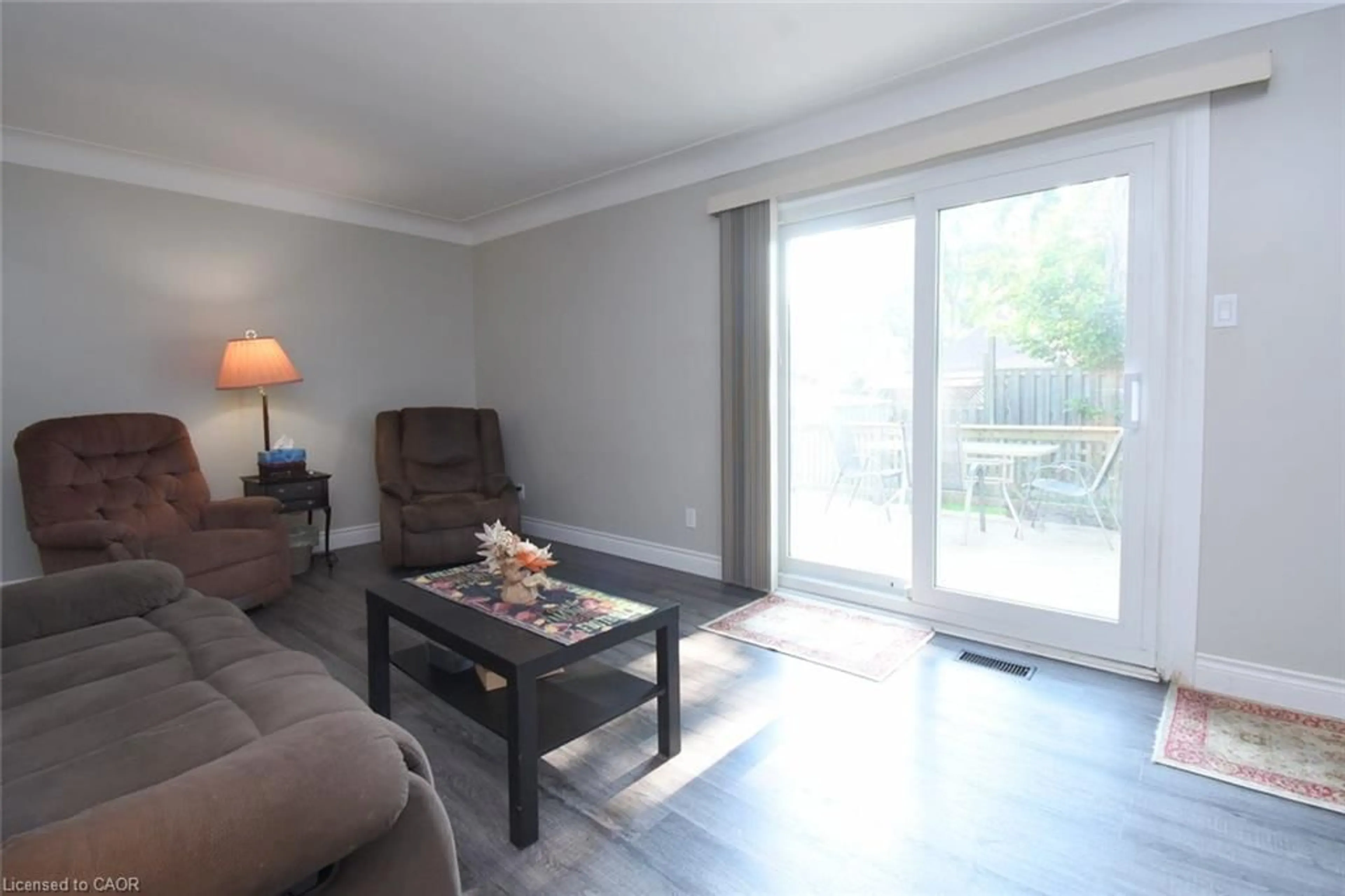 Living room with furniture, wood/laminate floor for 57 East 31st St, Hamilton Ontario L8V 3N8