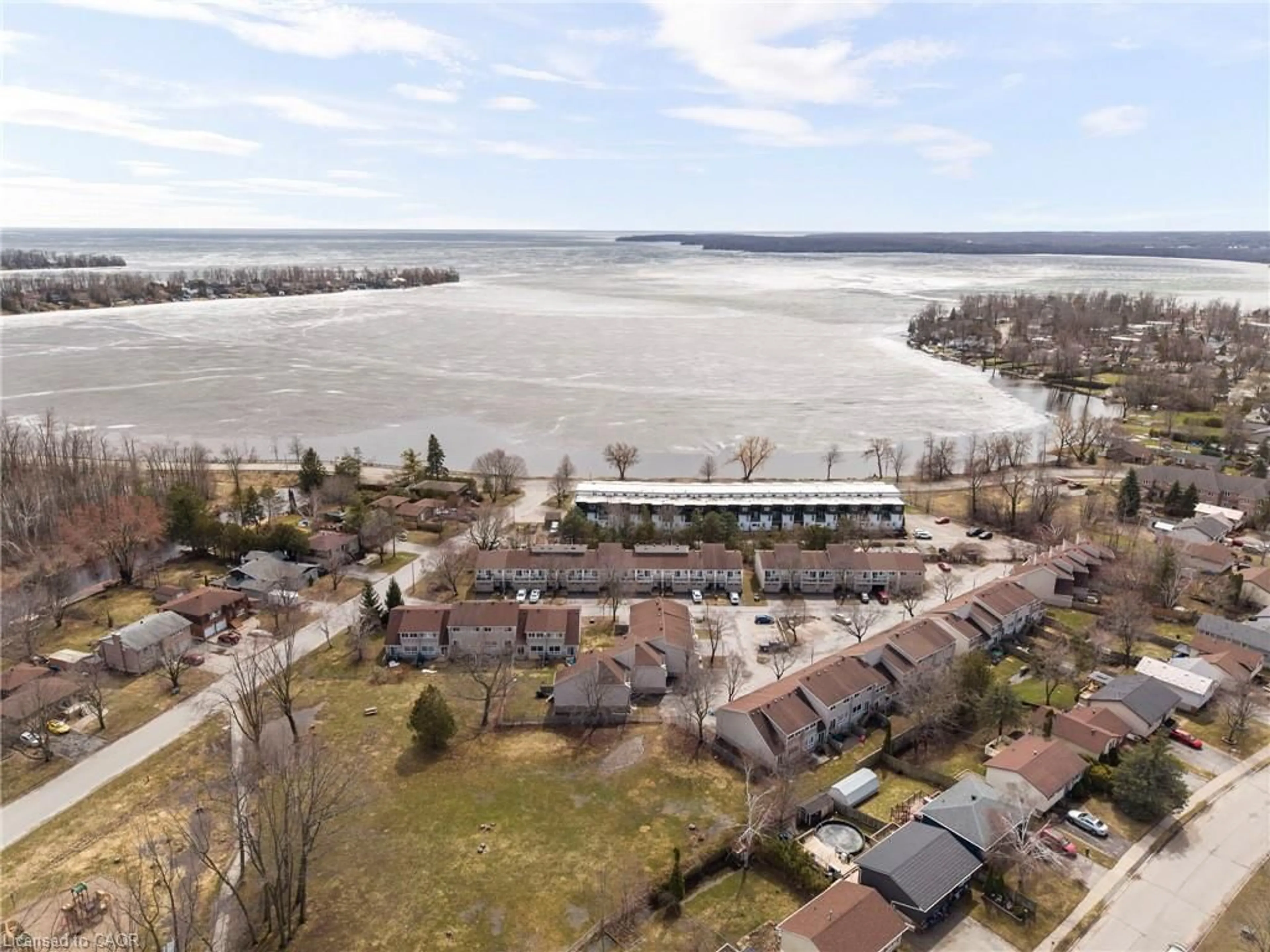 A pic from outside/outdoor area/front of a property/back of a property/a pic from drone, water/lake/river/ocean view for 12 Lankin Blvd #12, Orillia Ontario L3V 6T2