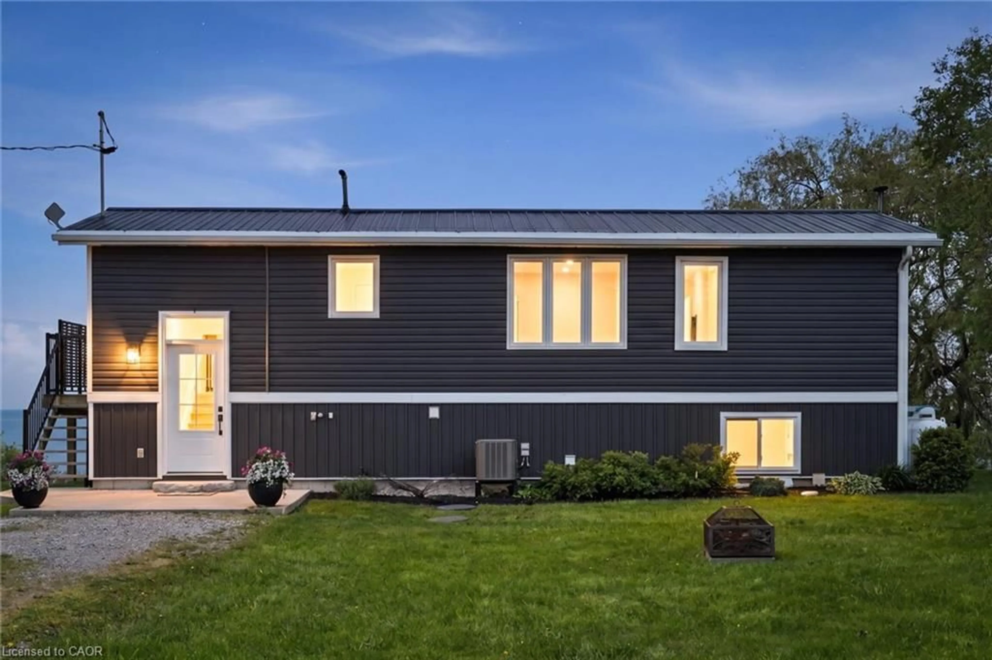 Home with vinyl exterior material, building for 402 South Coast Dr, Nanticoke Ontario N0A 1L0